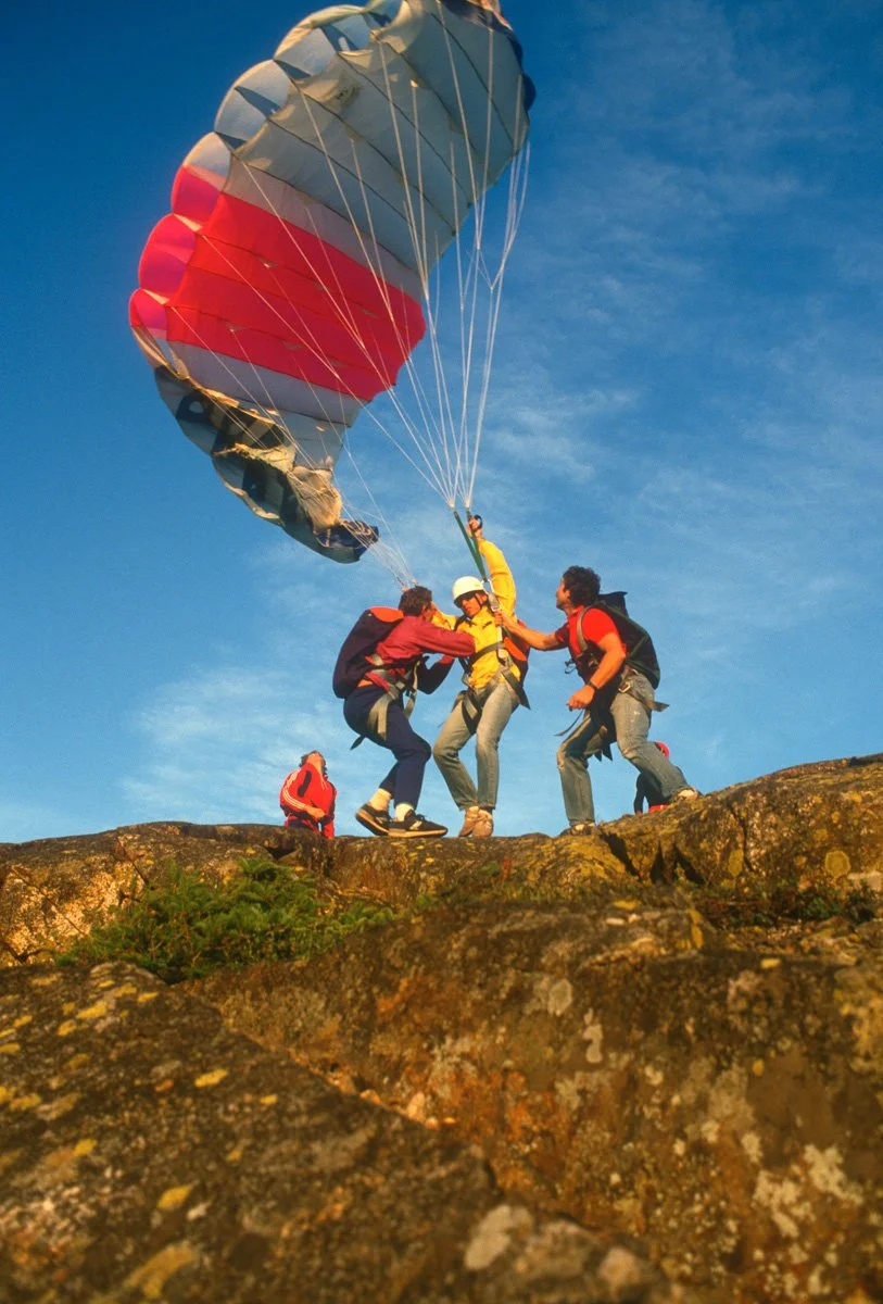 Autumn 1987:  New England isn’t prime paragliding terrain but we were into it and forced the issue and sometimes had to fight for it as happened here, on top of Mount Webster in New Hampshire. The pilot is one of Titoune Meunier’s nephews from France