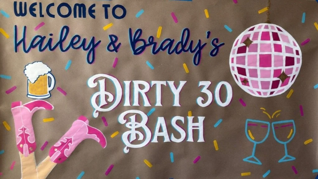 Custom banner reading 'Dirty 30 Bash' with colorful confetti, pink cowboy boots, pink disco ball, and drink glasses illustrations.