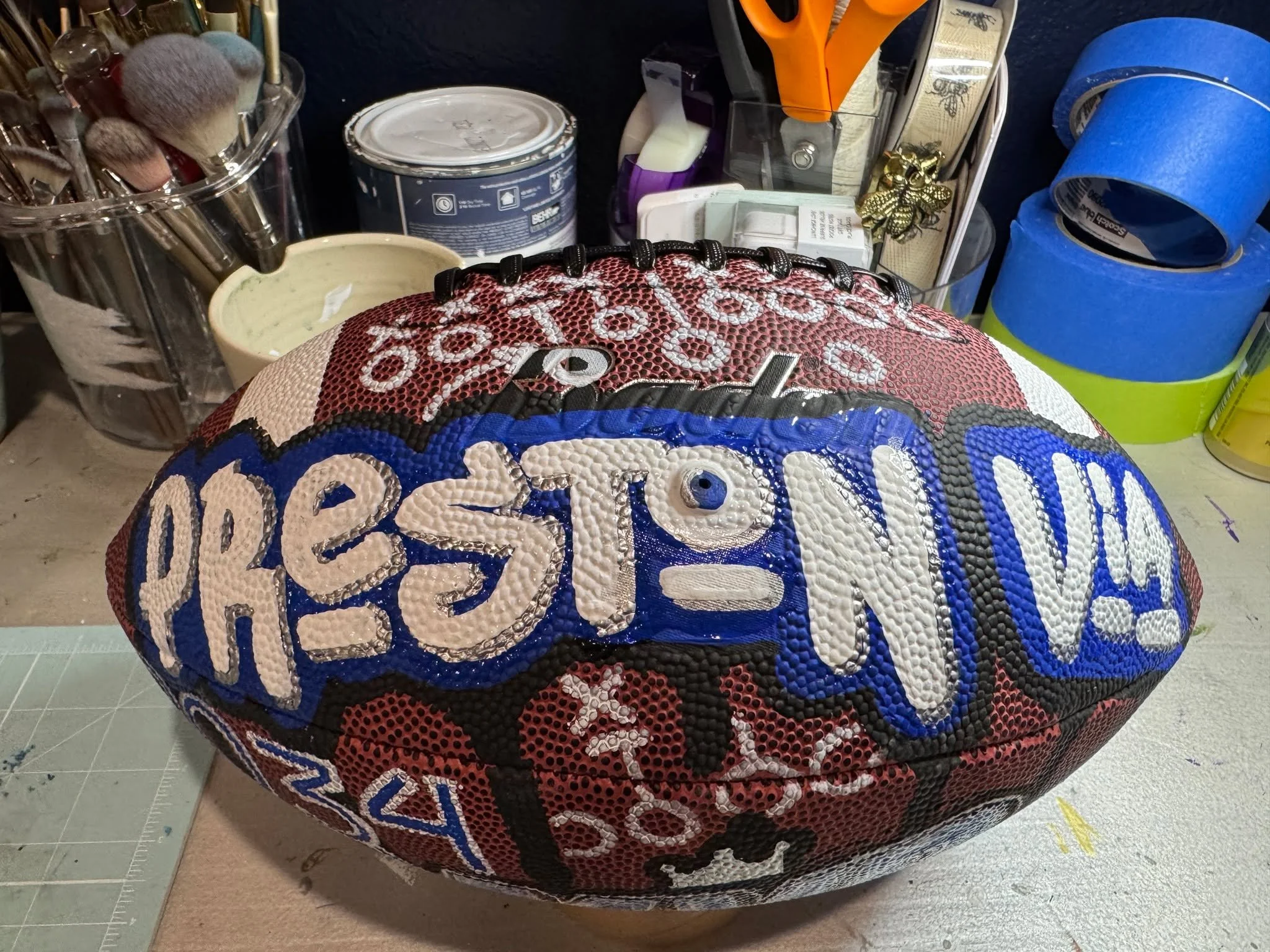 When big brother Jackson got a custom football last year, Preston decided that was absolutely unacceptable. So obviously, Preston needed one too. Fair is fair.

This hand-painted football was made just for Preston, featuring the Byron Nelson Bobcats 