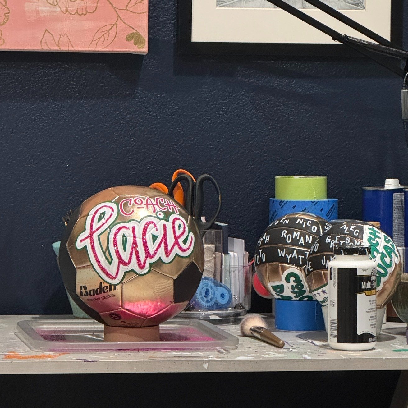 I have two desks in my office.

One where I do computer work.
One where I paint.

This morning I turned toward my painting desk and the sparkle on this ball caught my eye from across the room. The glitter hit the sunlight just right and for a second 