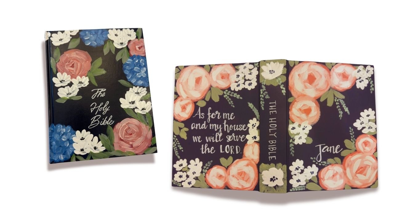 Two custom-painted Bibles featuring a floral design with roses and hydrangeas. One Bible cover reads 'As for me and my house, we will serve the Lord,' personalized with the name 'Jane.'