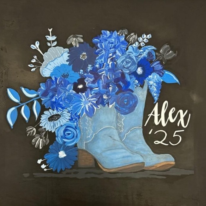Custom cheer box featuring floral design and a boot with "Alex '25".
