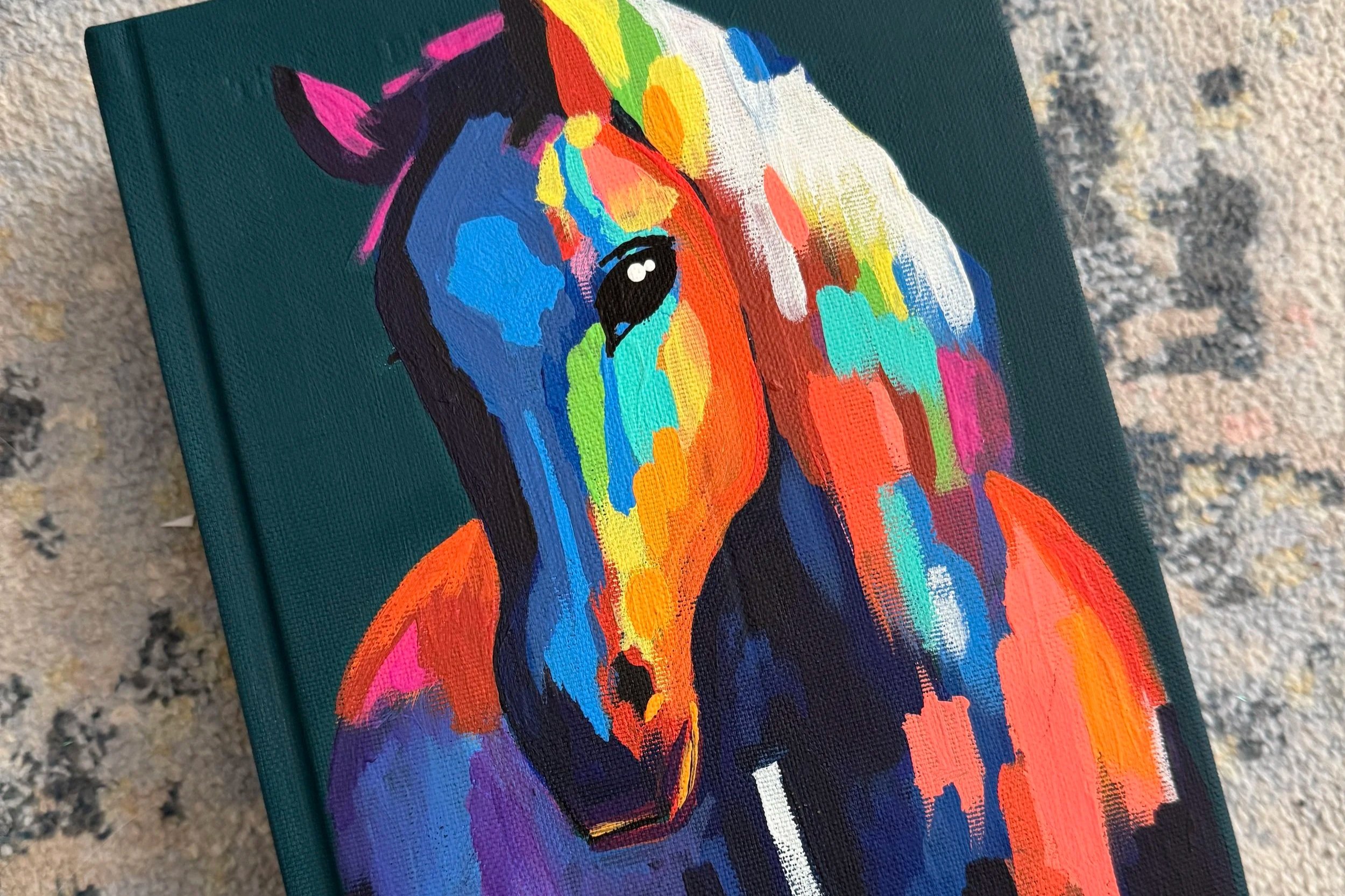 vibrantly-painted-horse-on-dark-blue-background
