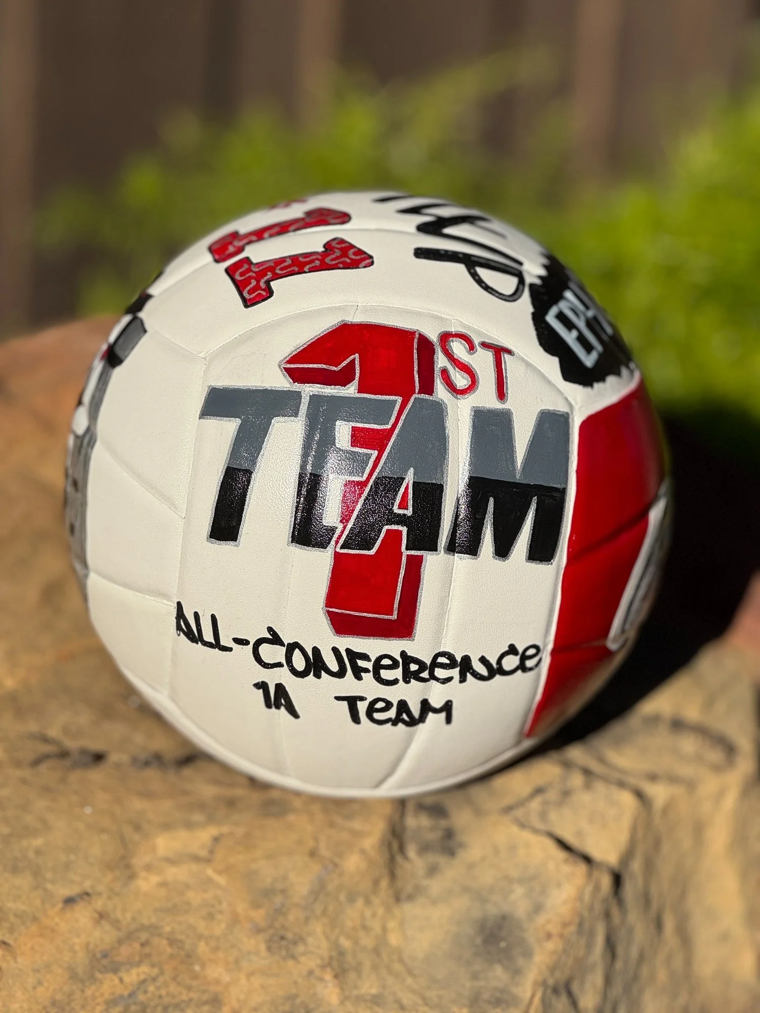 Hand-painted personalized volleyball celebrating an athlete's First Team All-Conference recognition