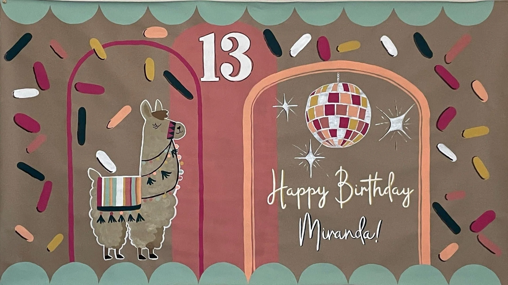 Colorful birthday card with a llama wearing a blanket and tassels, a disco ball, and the message 'Happy Birthday Miranda!' with a number 13 at the top; surrounded by multicolored sprinkles and a teal scalloped border.