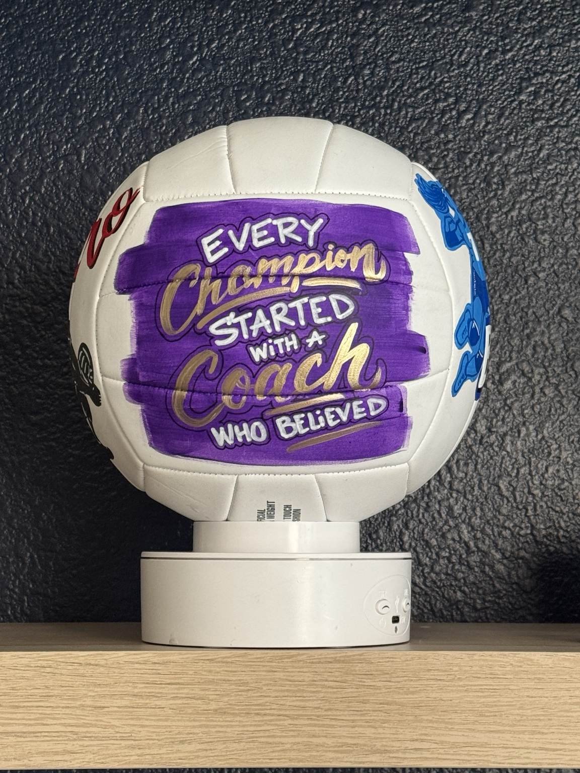Custom hand-painted volleyball featuring “Every Champion Started With a Coach Who Believed,” a personalized gift idea for athletes and coaches.