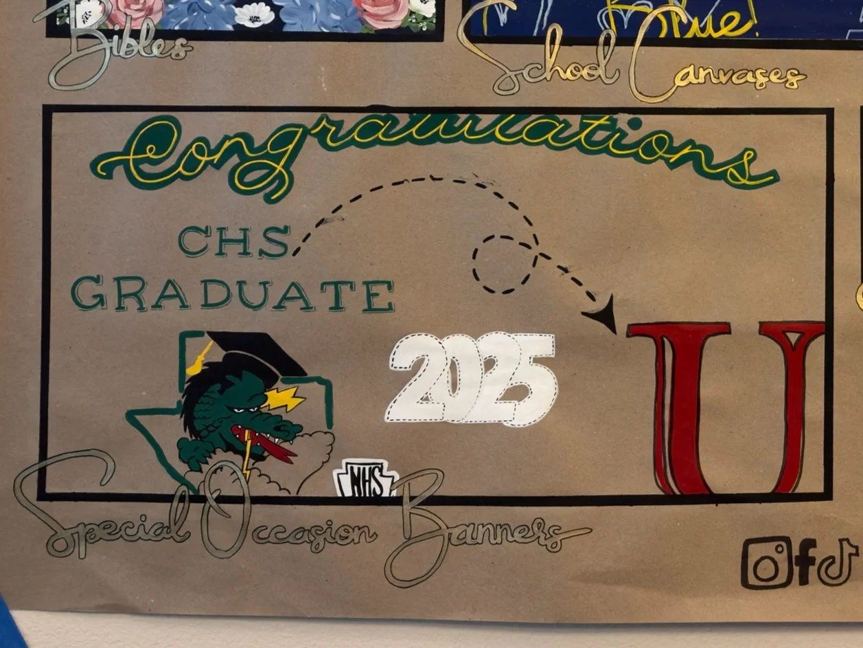 Graduation banner with text 'Congratulations CHS Graduate 2025' featuring a green dragon mascot wearing a graduation cap. Includes decorative elements and text promoting special occasion banners.