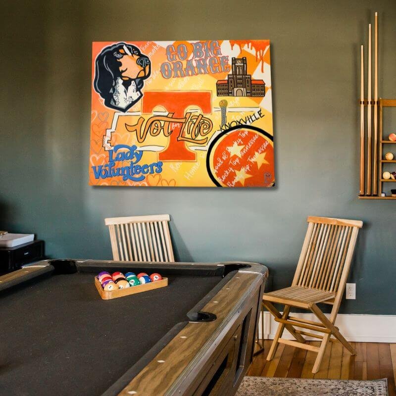 Game room with pool table and large custom-painted canvas in University of Tennessee theme hanging on wall.