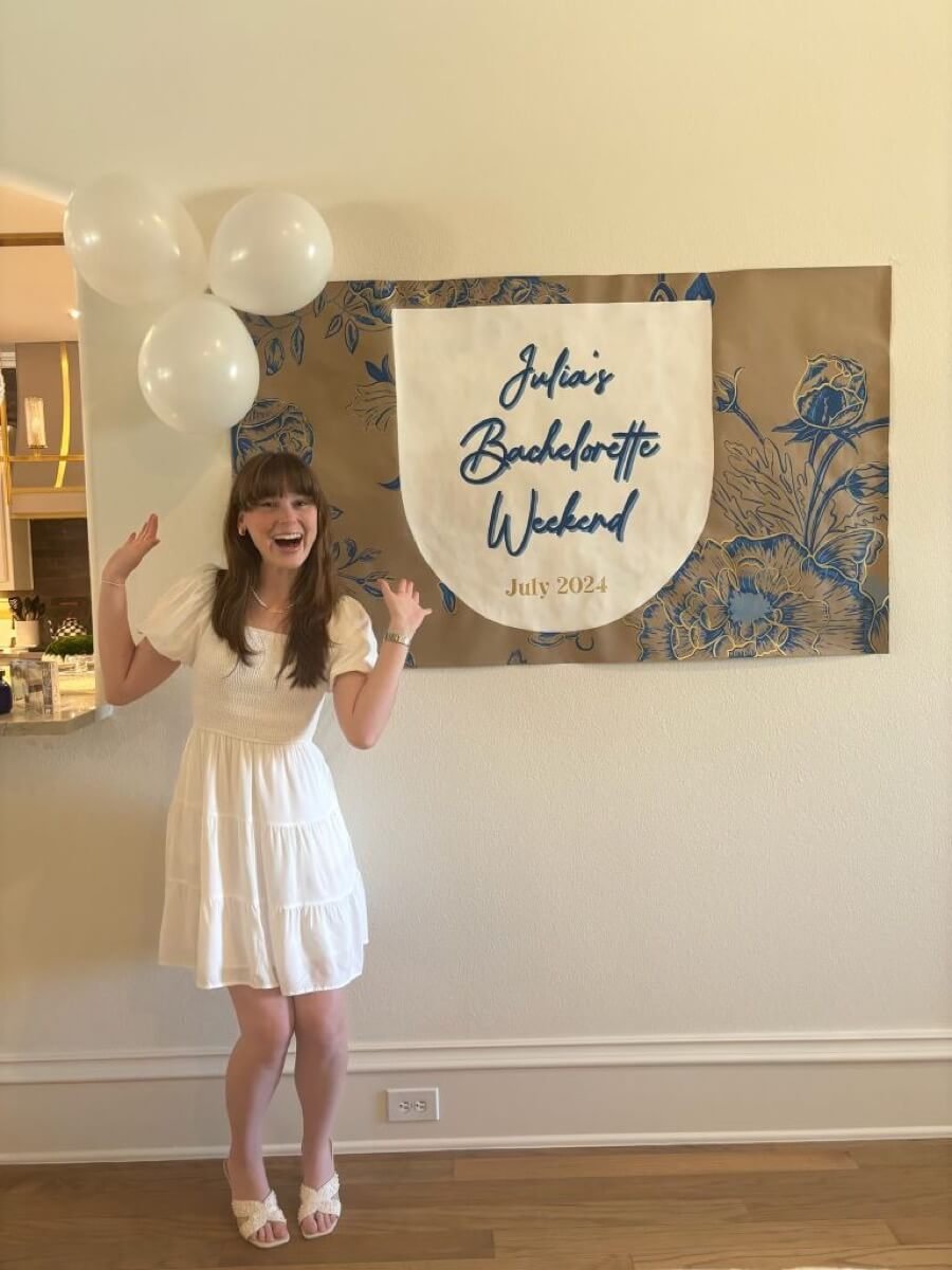 Hand-painted bachelorette weekend banner for Julia’s celebration, with floral elements.