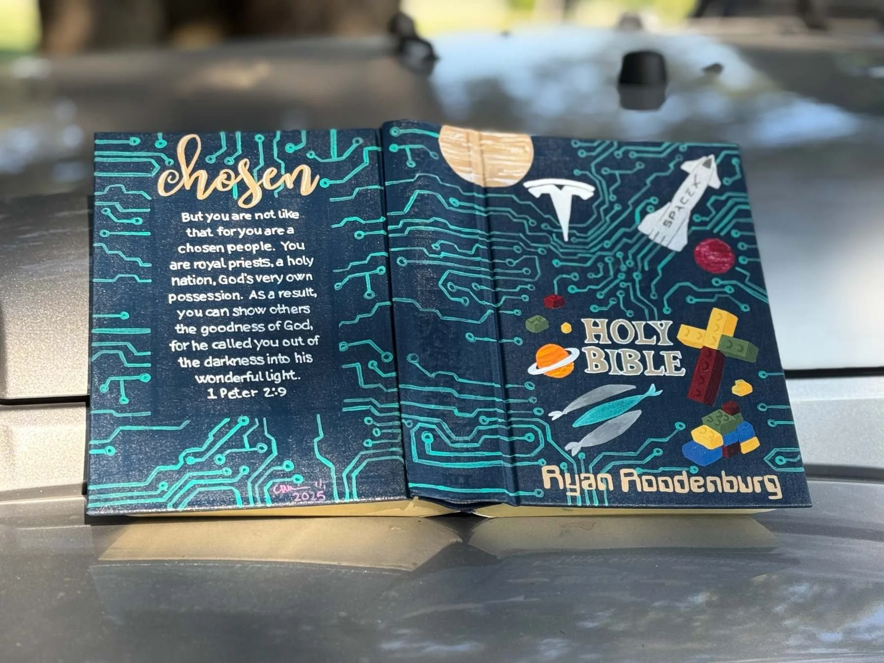 Custom hand-painted Bible with circuit board, Tesla, SpaceX and personalized Christian artwork.