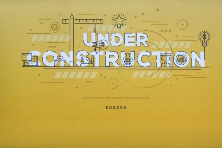 "Under Construction" banner with science-related icons, indicating that the webpage is coming soon.