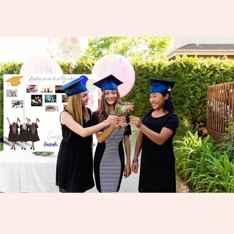 graduates-toasting-with-hand-painted-custom-photo-board-on-table-in-background.jpg.jpg
