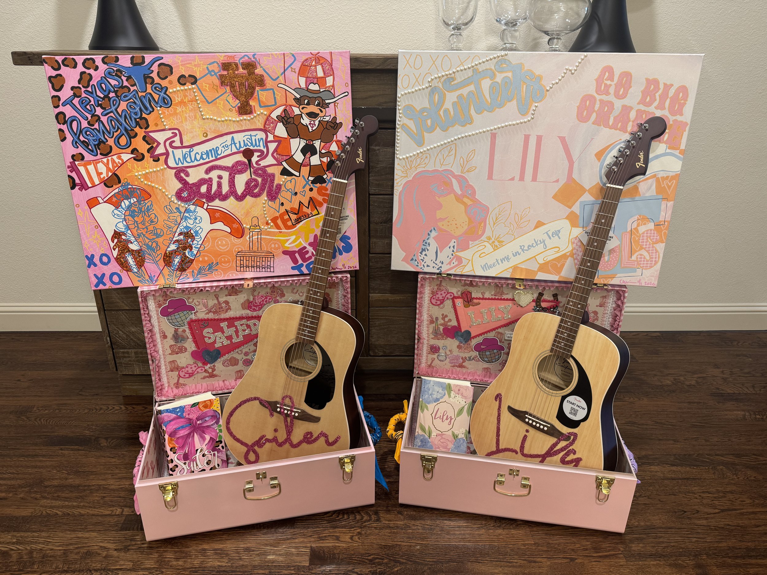 Unique custom canvases hand painted for Sailer and Lily, personalized for each of their university destination, with custom guitars and luggage cases.