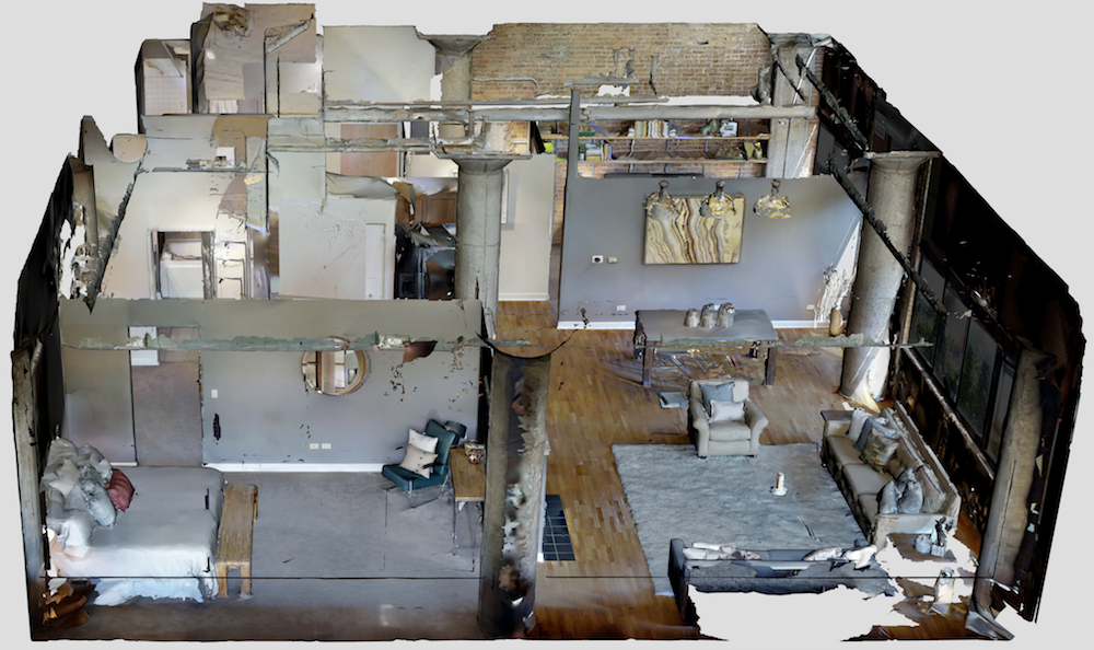A 3D model of a modern, multi-room interior. It features a living area with sofas, armchairs, and a rug, a dining area with a table and hanging pendant lights, and an open kitchen with visible countertops and cabinets. The space has large windows along one wall, columns, and exposed brick and concrete walls.