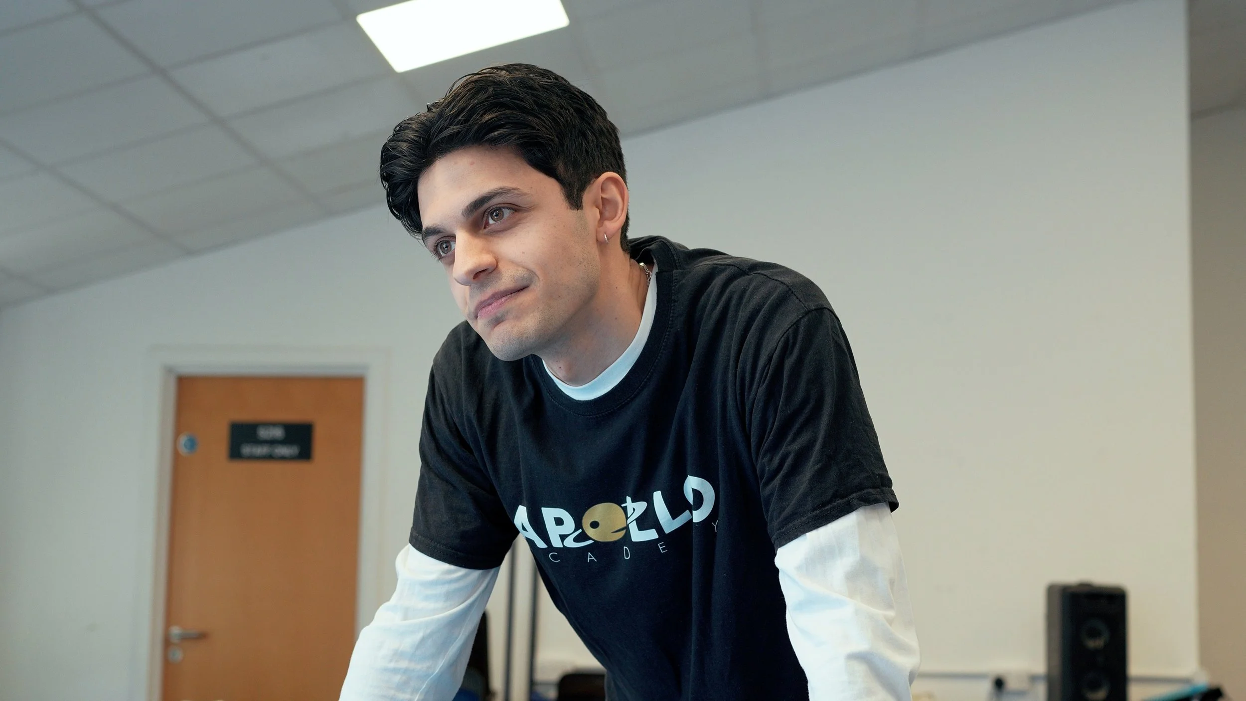 An actor wearing an Apollo Theatre Arts t shirt during an acting workshop