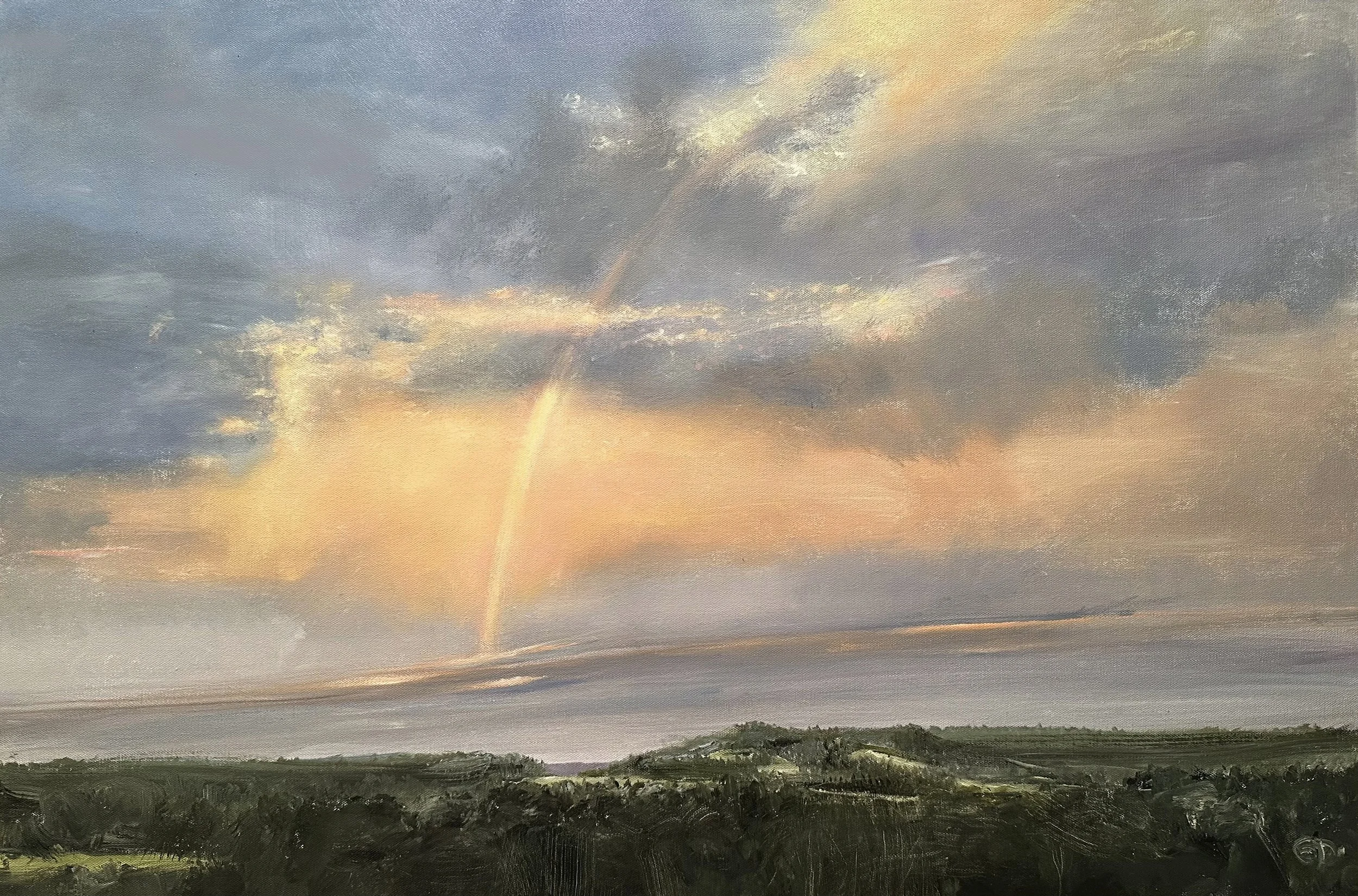 A landscape painting depicting a distant mountain range under a sky with dramatic clouds and a rainbow during sunset.