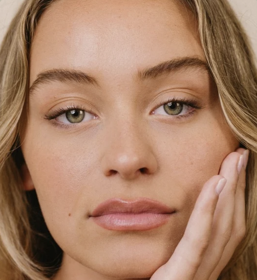 Close-up of a person's face with open eyes and lips slightly parted.