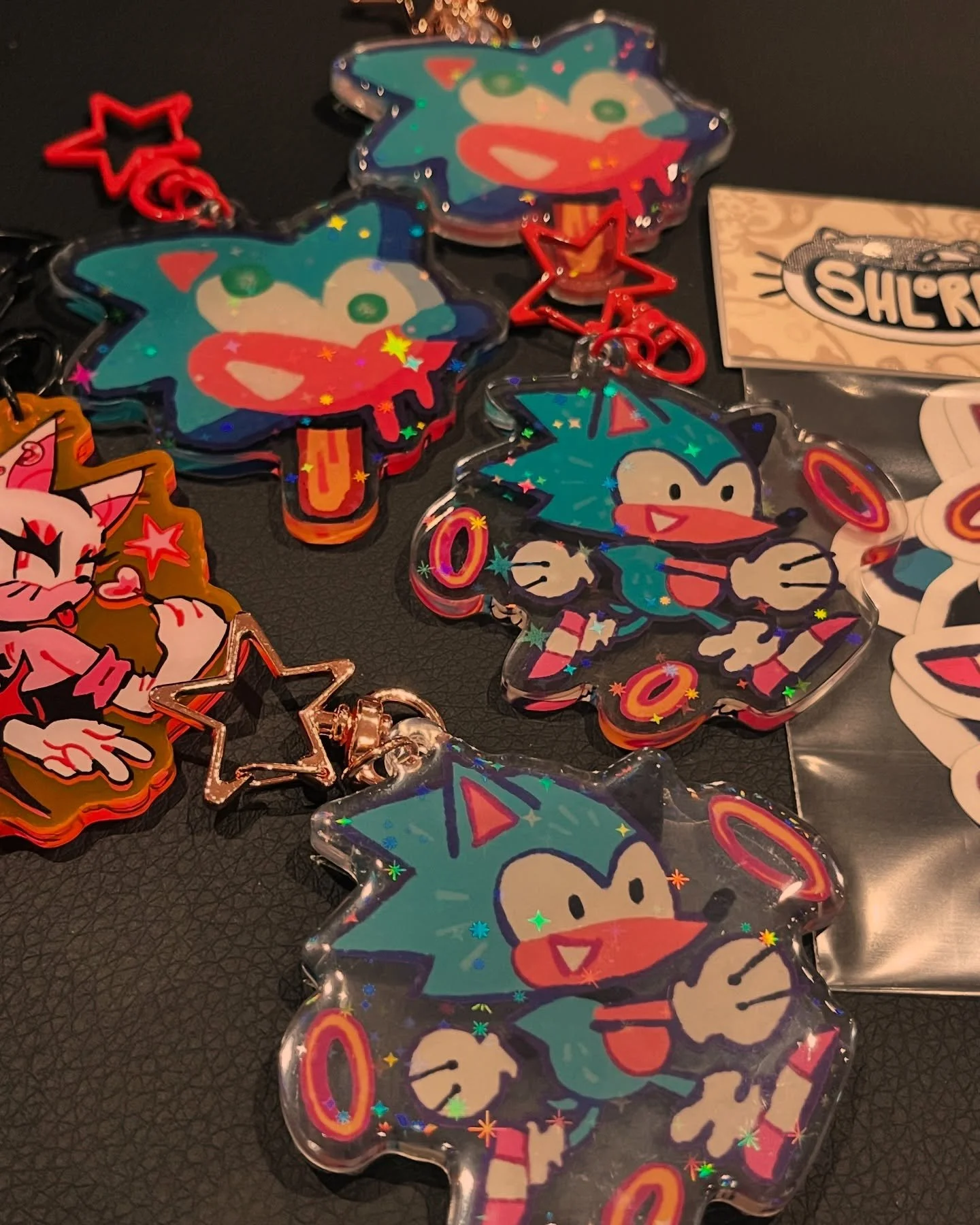 Here is the sonic merch I&rsquo;ll have this Saturday at @sacrilege.tattoo &lsquo;s Sonic Day!!! A mix of epoxy and acrylic charms as well as a sticker pack! I will also have my usual prints/stickers/keychains available as well :).

 I also still hav