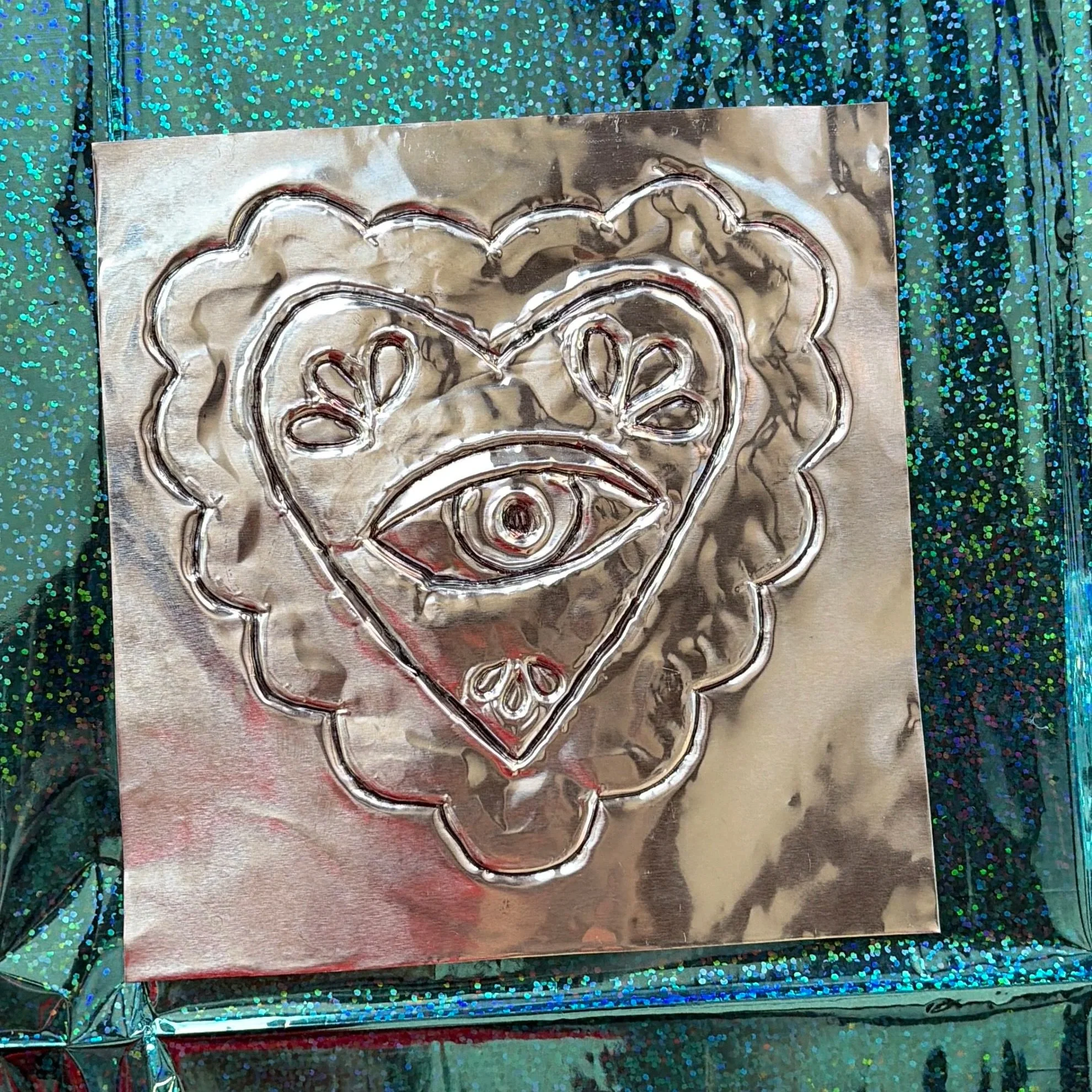 Attendees embossed piece created using their an existing template mixed with their original design. 