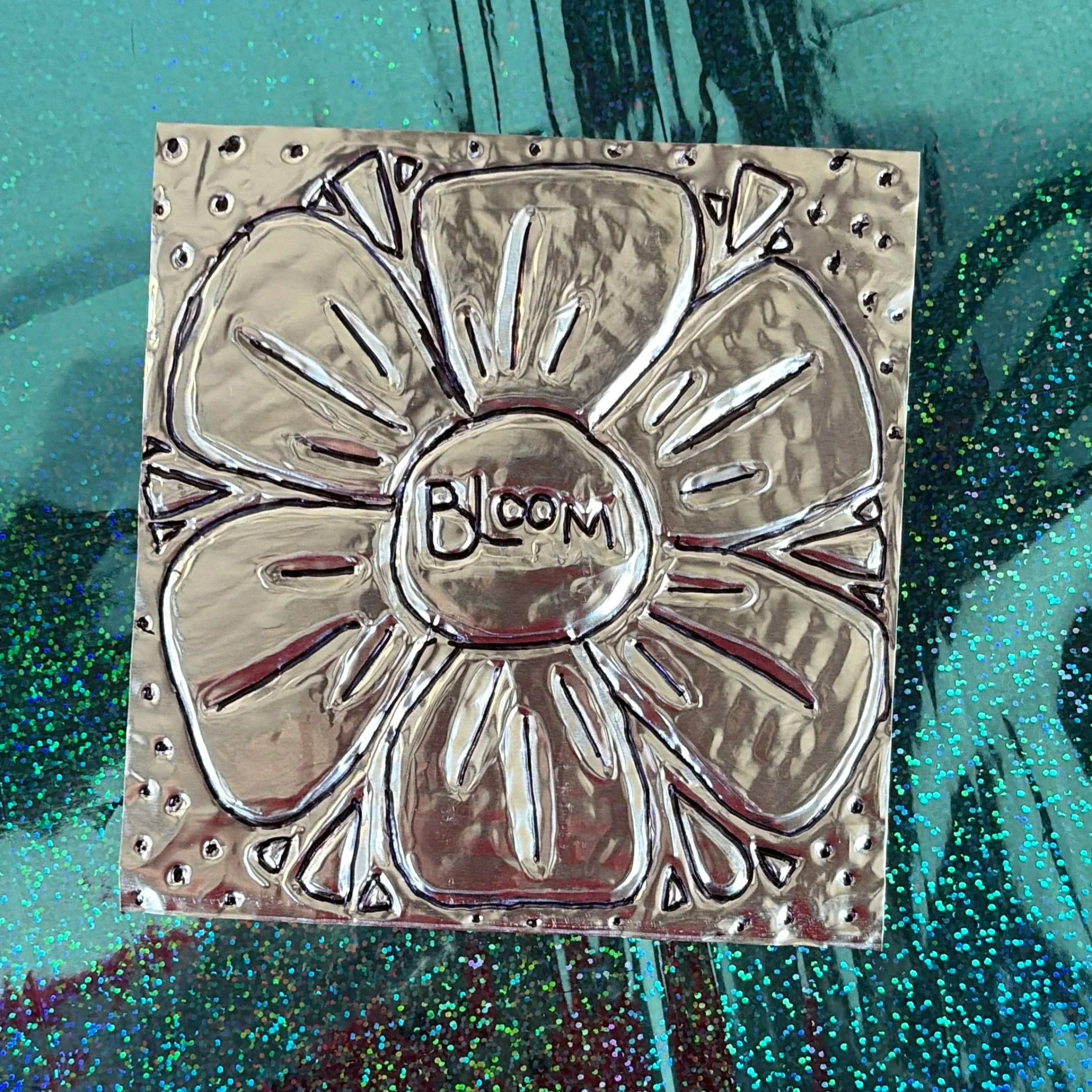 Attendees embossed piece created using their original design. 