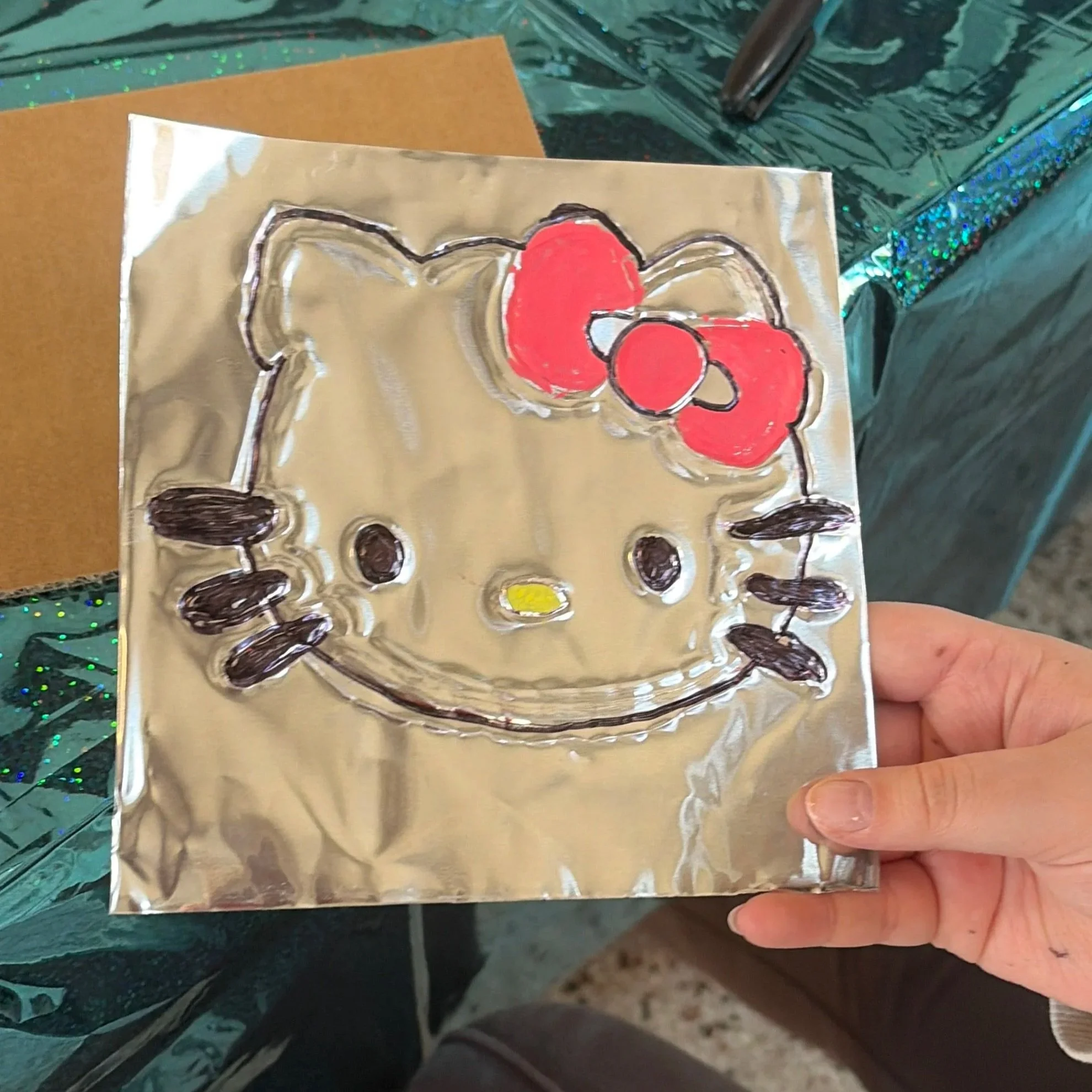 9 year old attendee's embossed piece created using their original design. 