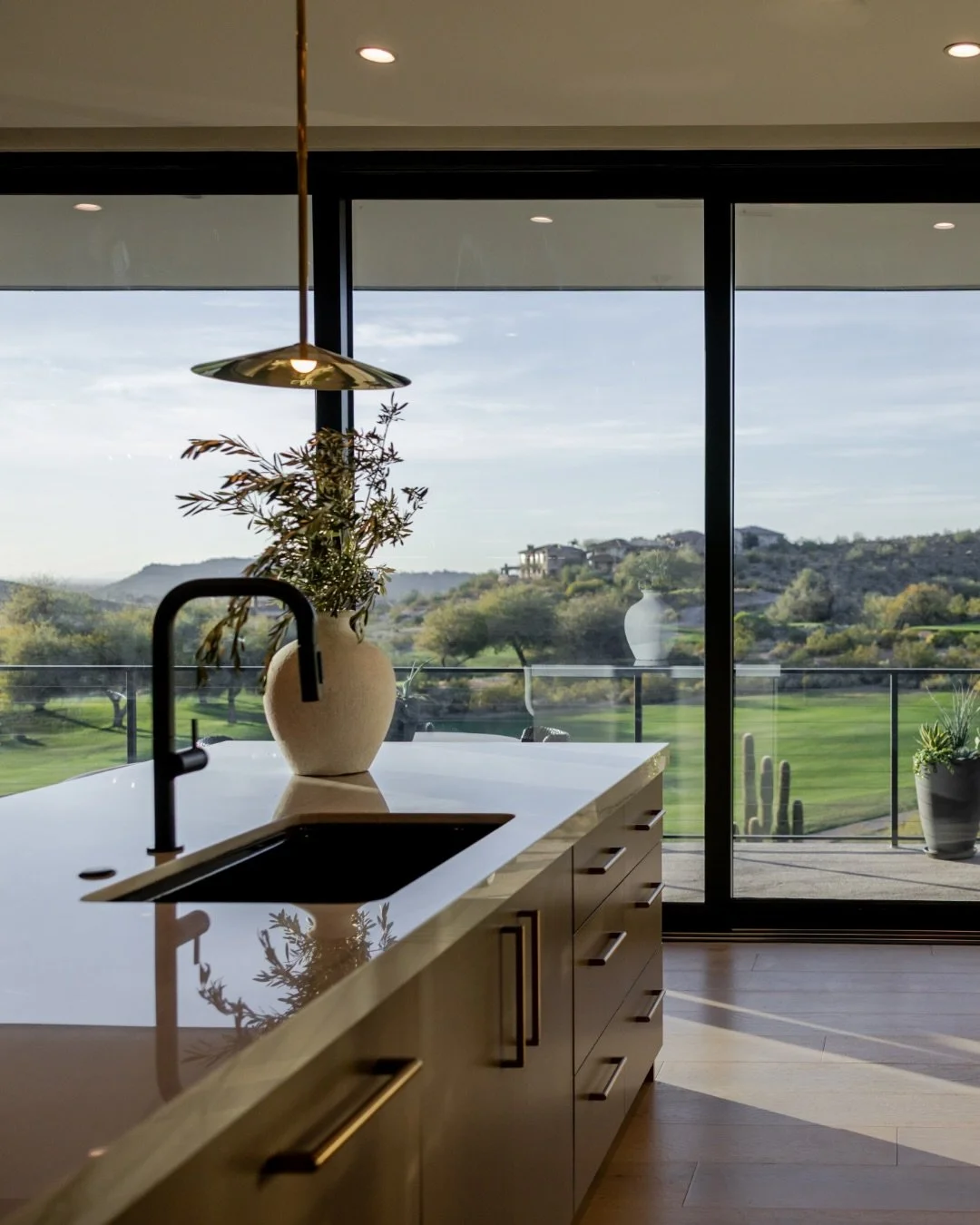 Our Outlook Mountain kitchen  was designed to fully embrace its surroundings, with expansive doors that open wide, blurring the line between inside and out.

And when the sun starts to set&hellip; the entire space transforms.
Warm light pouring in, s
