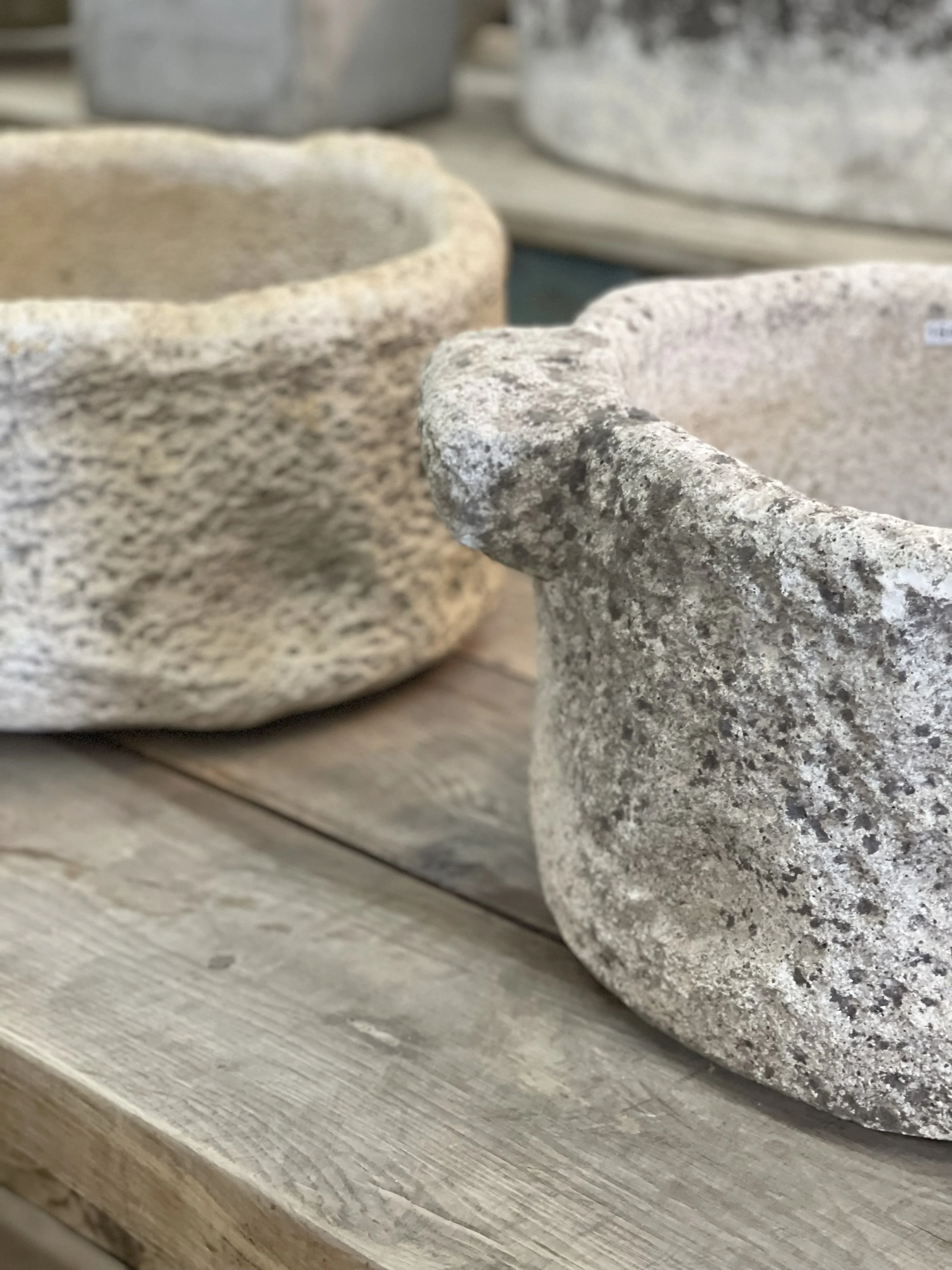 Western Organic Modern design details – textured stone vessels styled on wood and custom built-in shelving with curated decor, neutral tones, and natural materials by Wren House Design in Arizona.