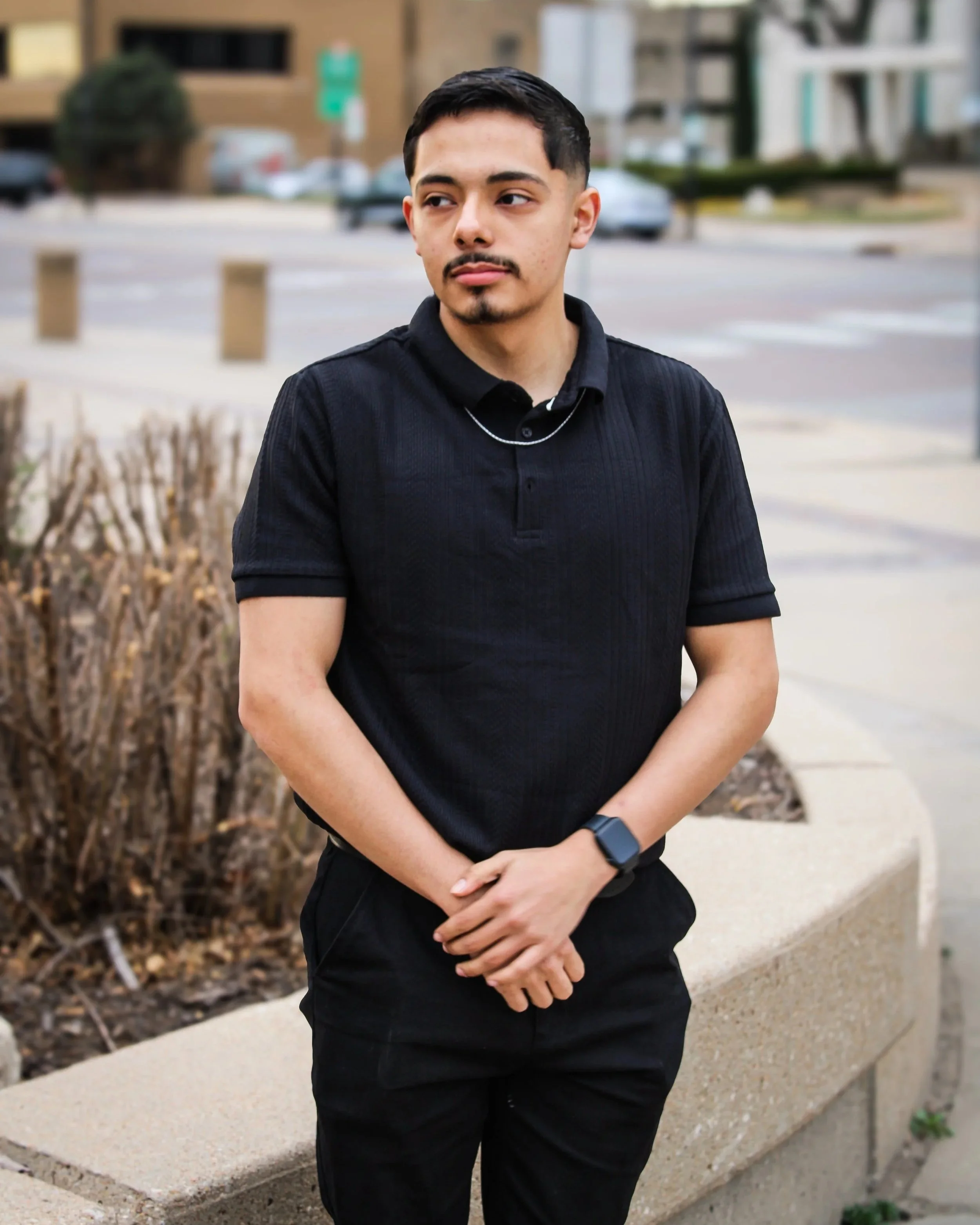 Young male standing in downtown Wichita for portraits.