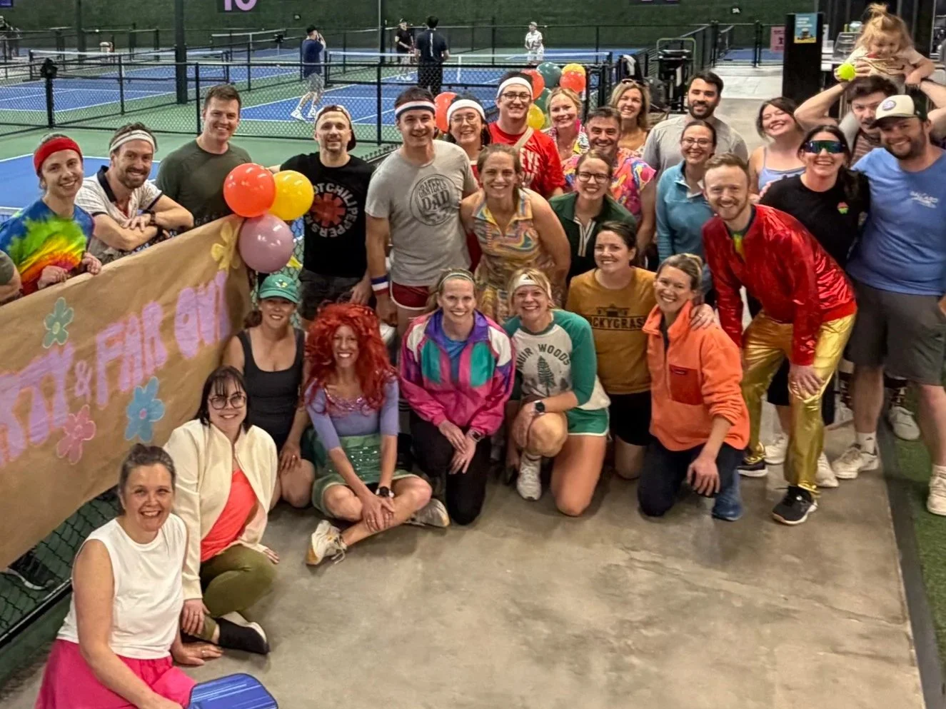Members gathered on court at a club event.