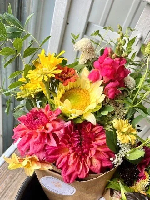 sunny and ferncliff copper bouq in shop on white stand, natural light.jpg