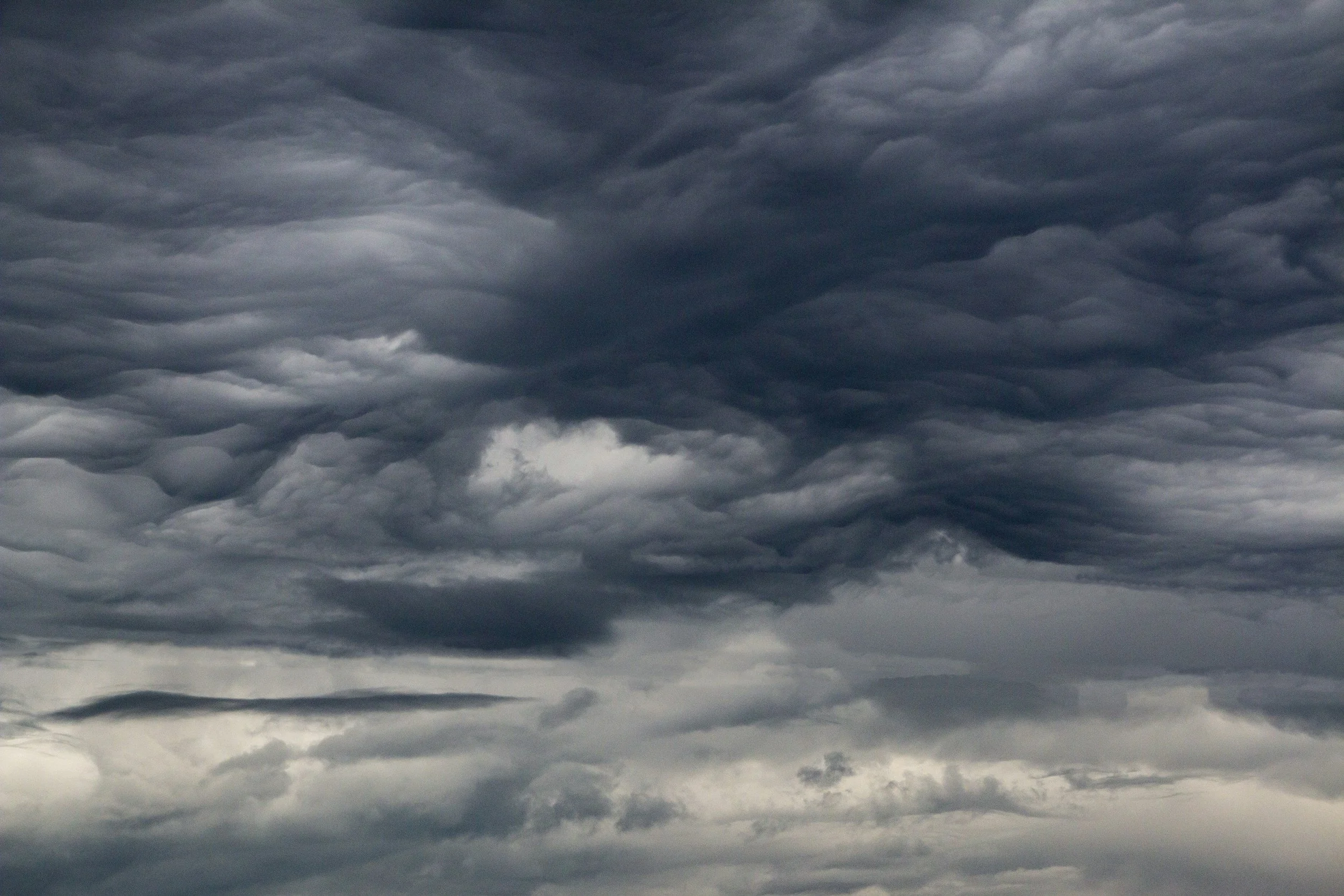 Dark storm clouds representing the persistent and overwhelming feeling of generalized anxiety treated at Snow Globe Counseling in Washington and Arizona