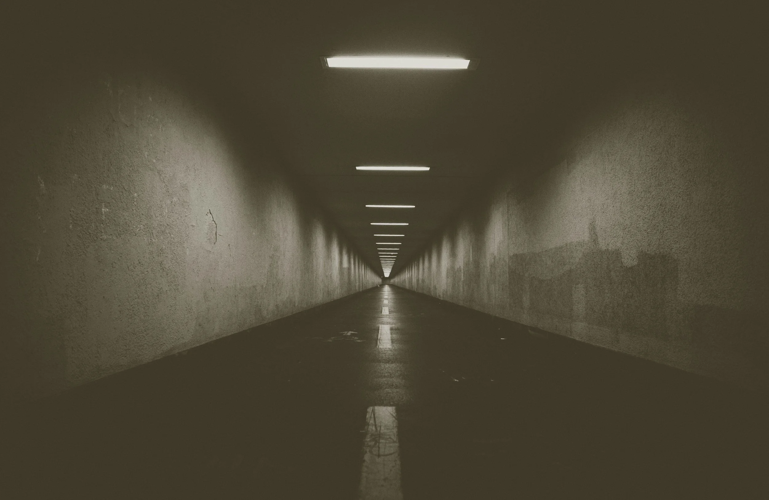 A long empty tunnel representing the overwhelming and disorienting experience of panic attacks treated through anxiety therapy in Washington and Arizona
