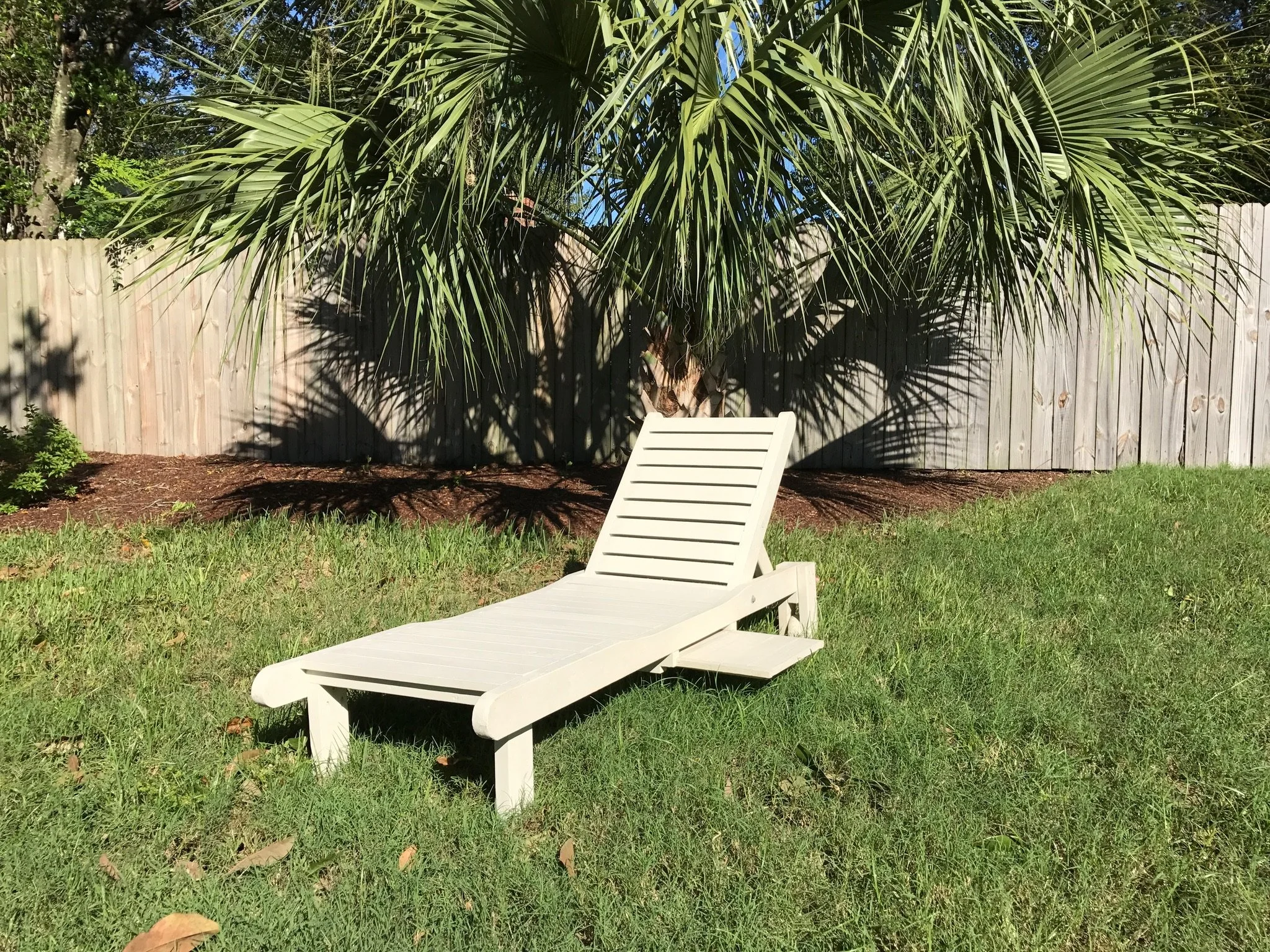 Custom lounger with slide out table 