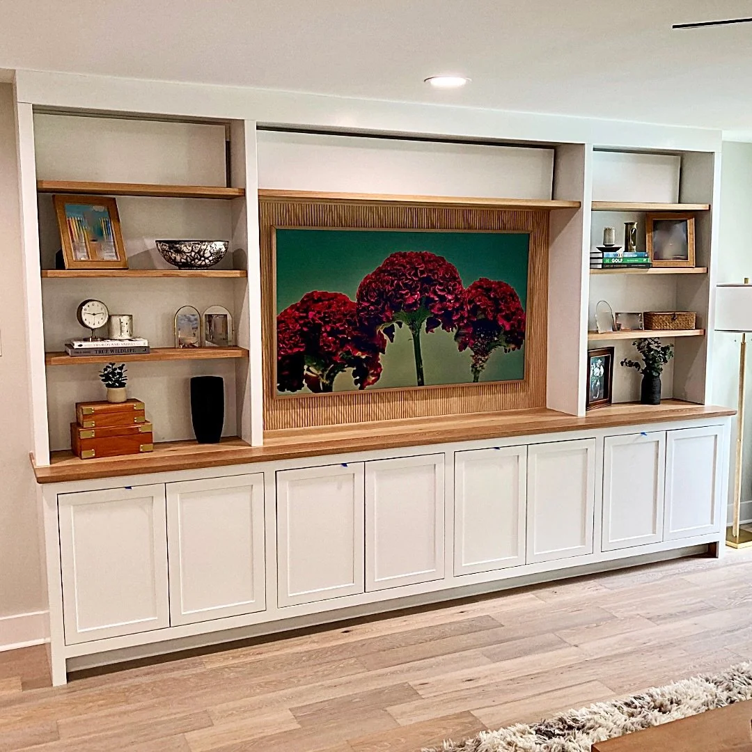 Entertainment center build by D3 Woodworks primarily out of plywood with a white oak countertop