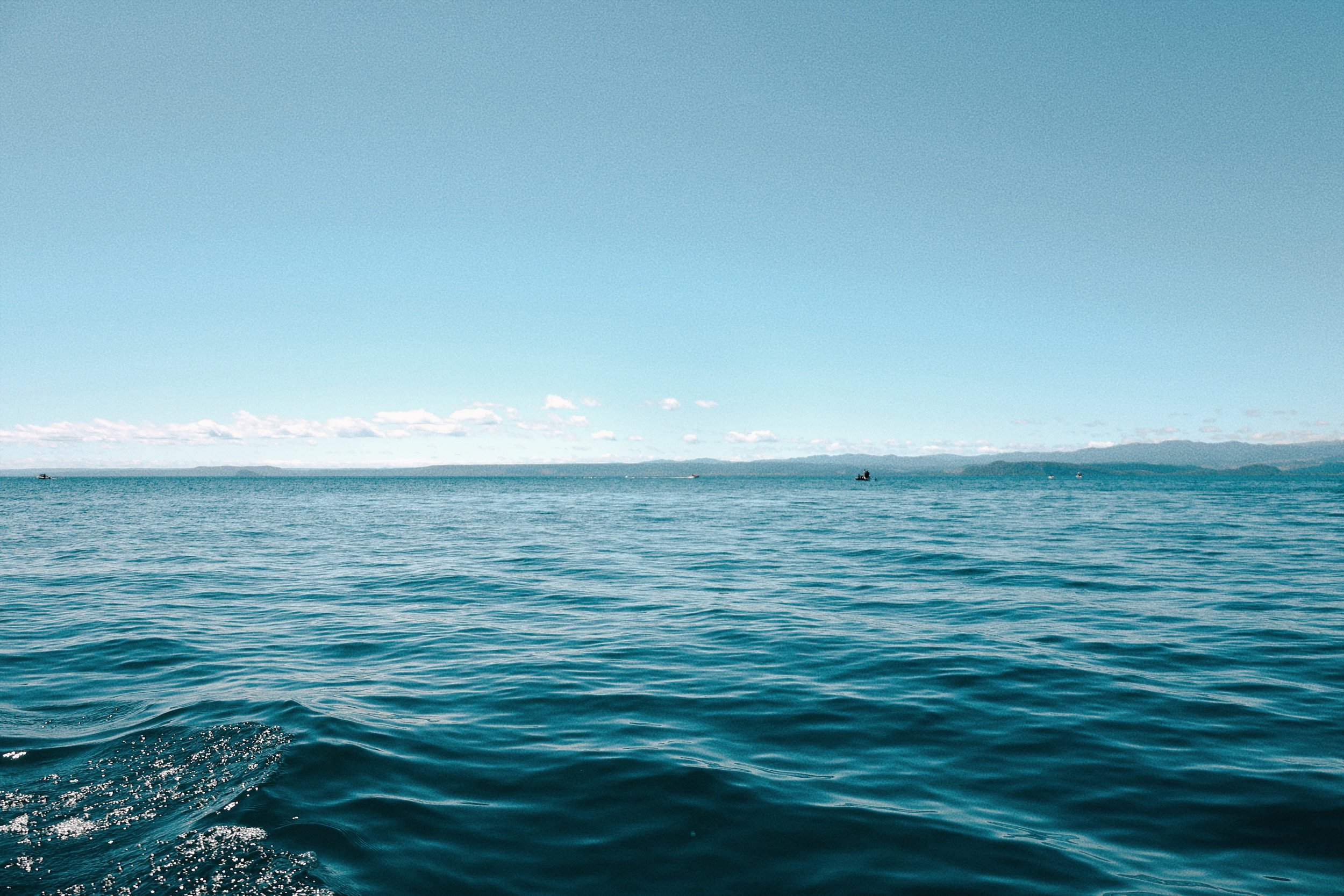 Lake Taupo view with distant horizon and few clouds