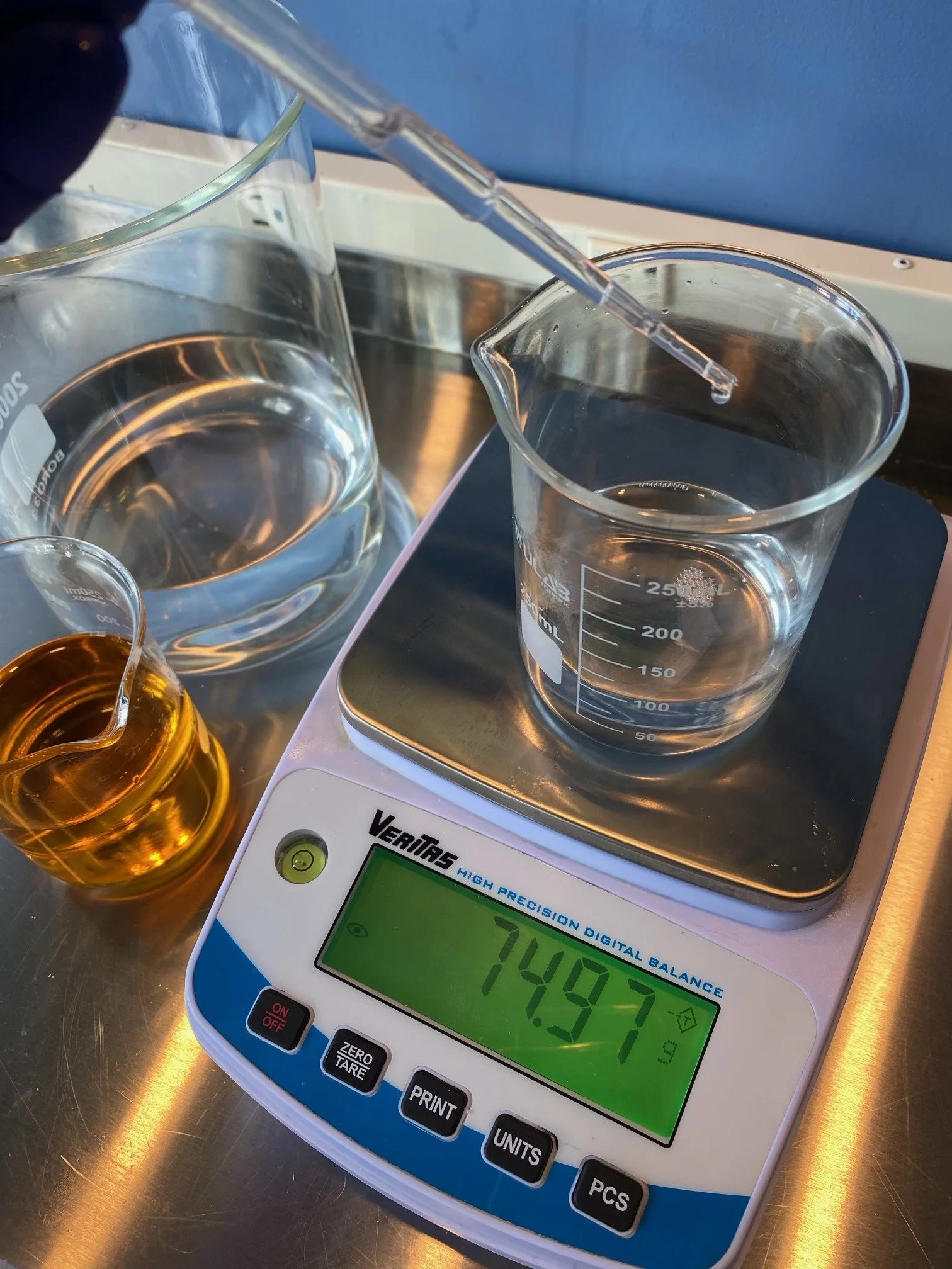 Weighing ingredients on the lab scale for a small batch