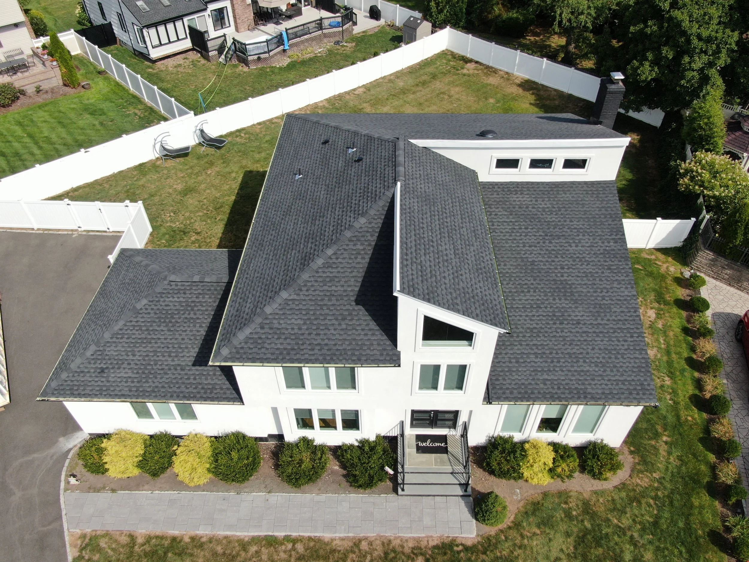 Overhead drone view of completed roof replacement in Springfield, NJ with Timberline UHDZ shingles in Charcoal.