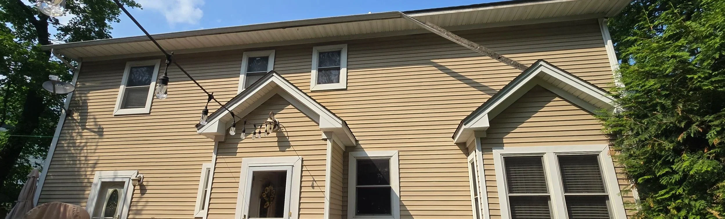 Failing gutter pulling away from fascia in Roseland, NJ before full gutter replacement and new gutter guards.