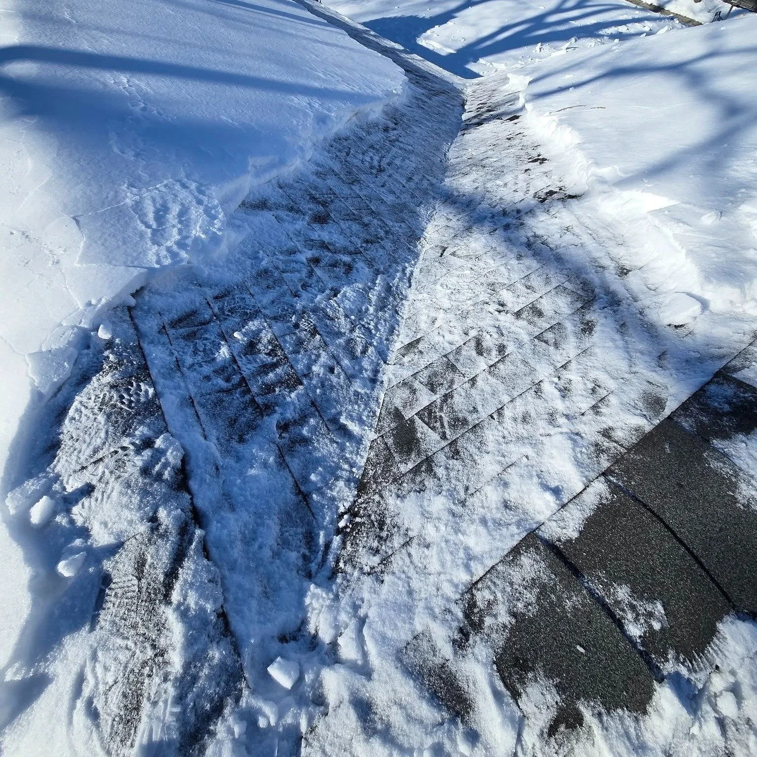 Montclair, NJ—snow-covered roof with ice damming before snow removal and ice dam mitigation.