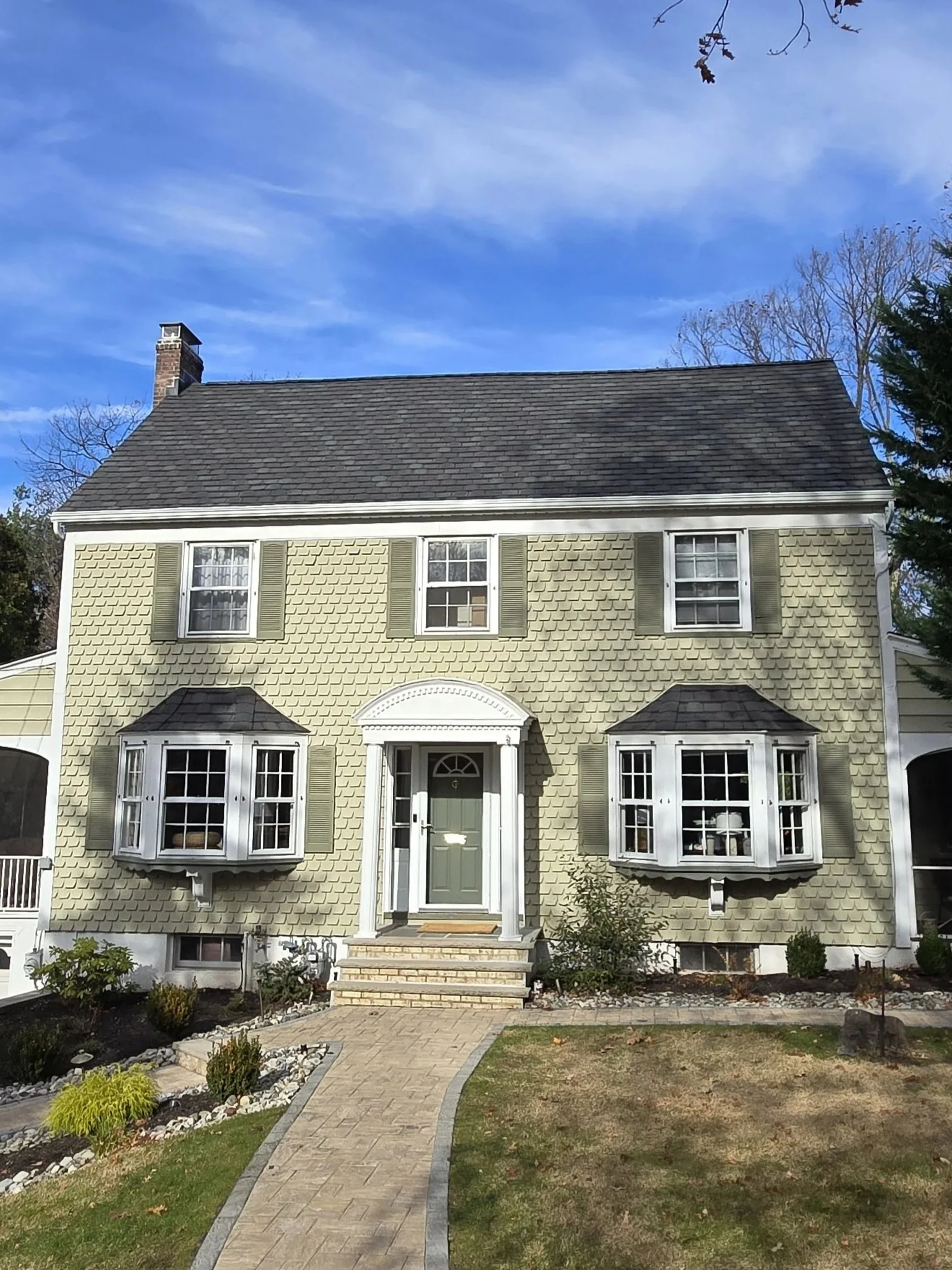 Full roof and gutter replacement in Cedar Grove, NJ with GAF Camelot II Antique Slate and GAF Timberline UHDZ Charcoal shingles, plus new gutters and gutter guards.