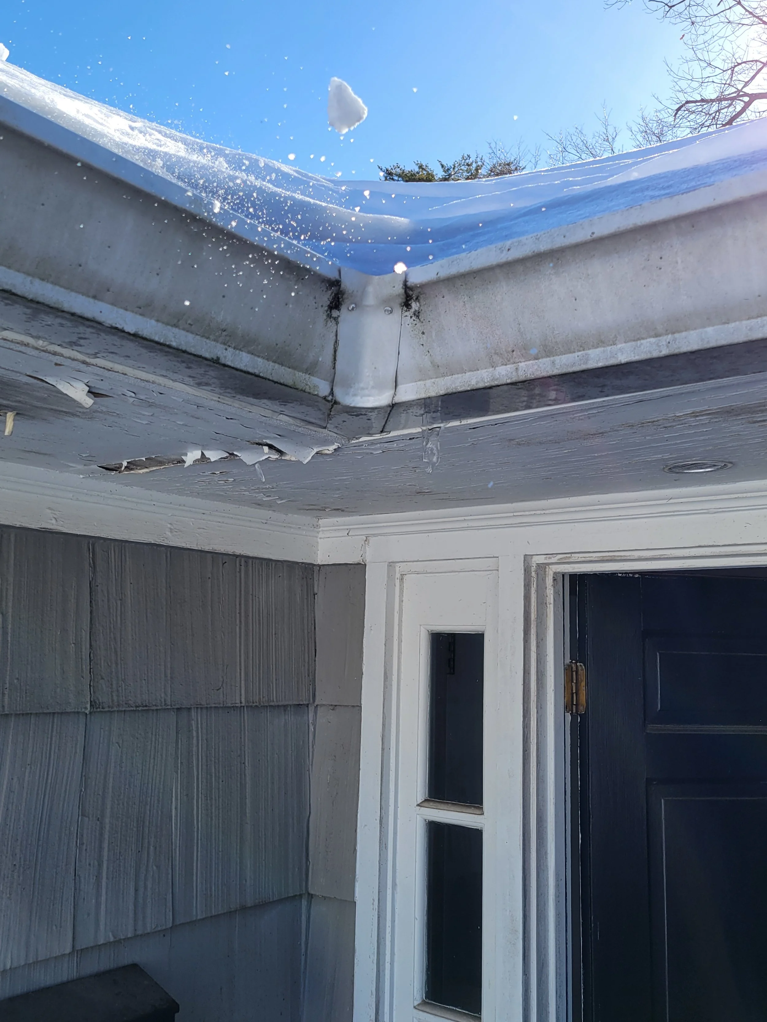 Ice damming in gutter that lead to snow accumulation on top of the roof in Montclair, NJ.