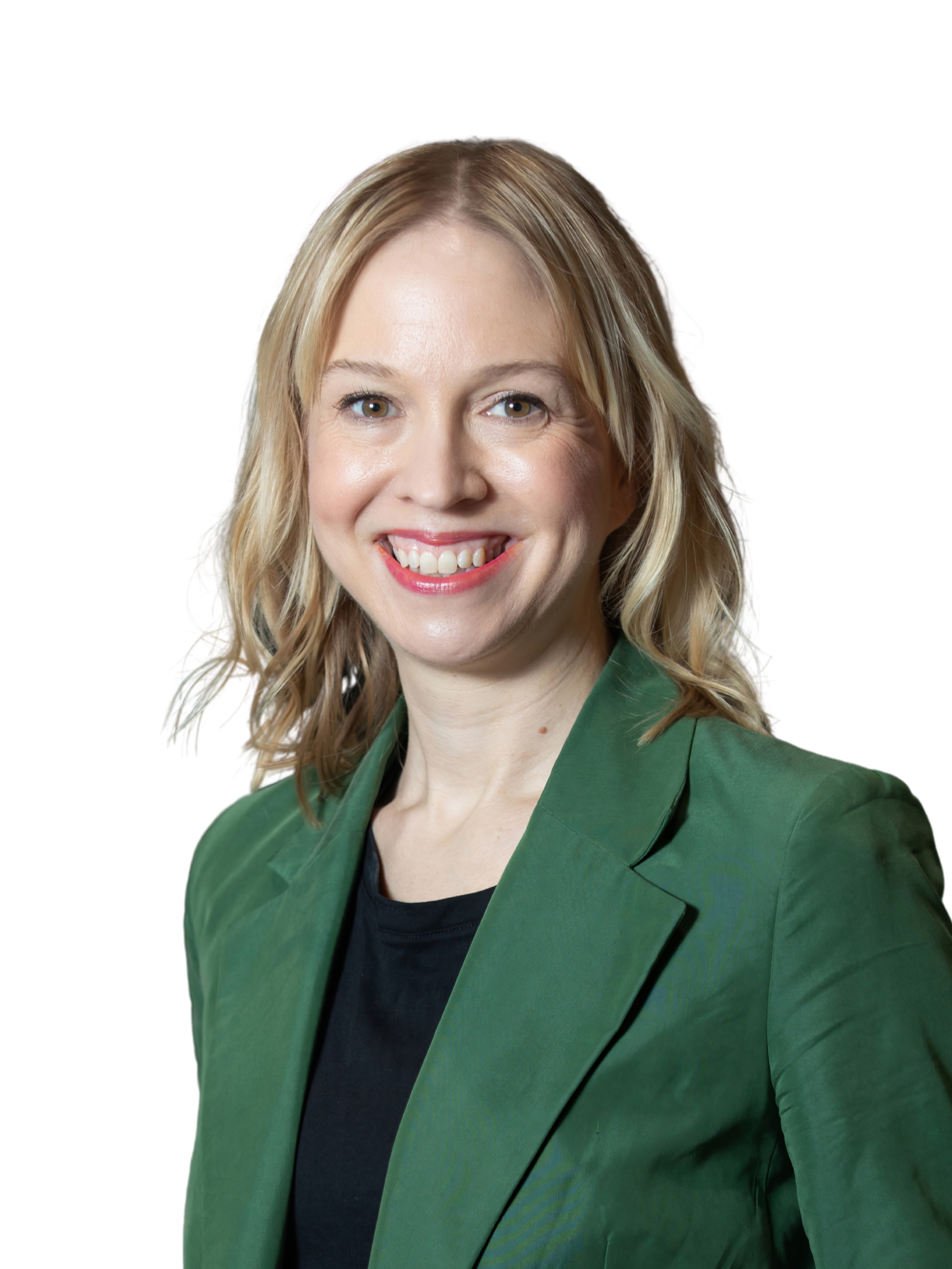 A woman with blonde hair wearing a red blazer and white blouse, holding a pink folder, smiling against a light gray background.