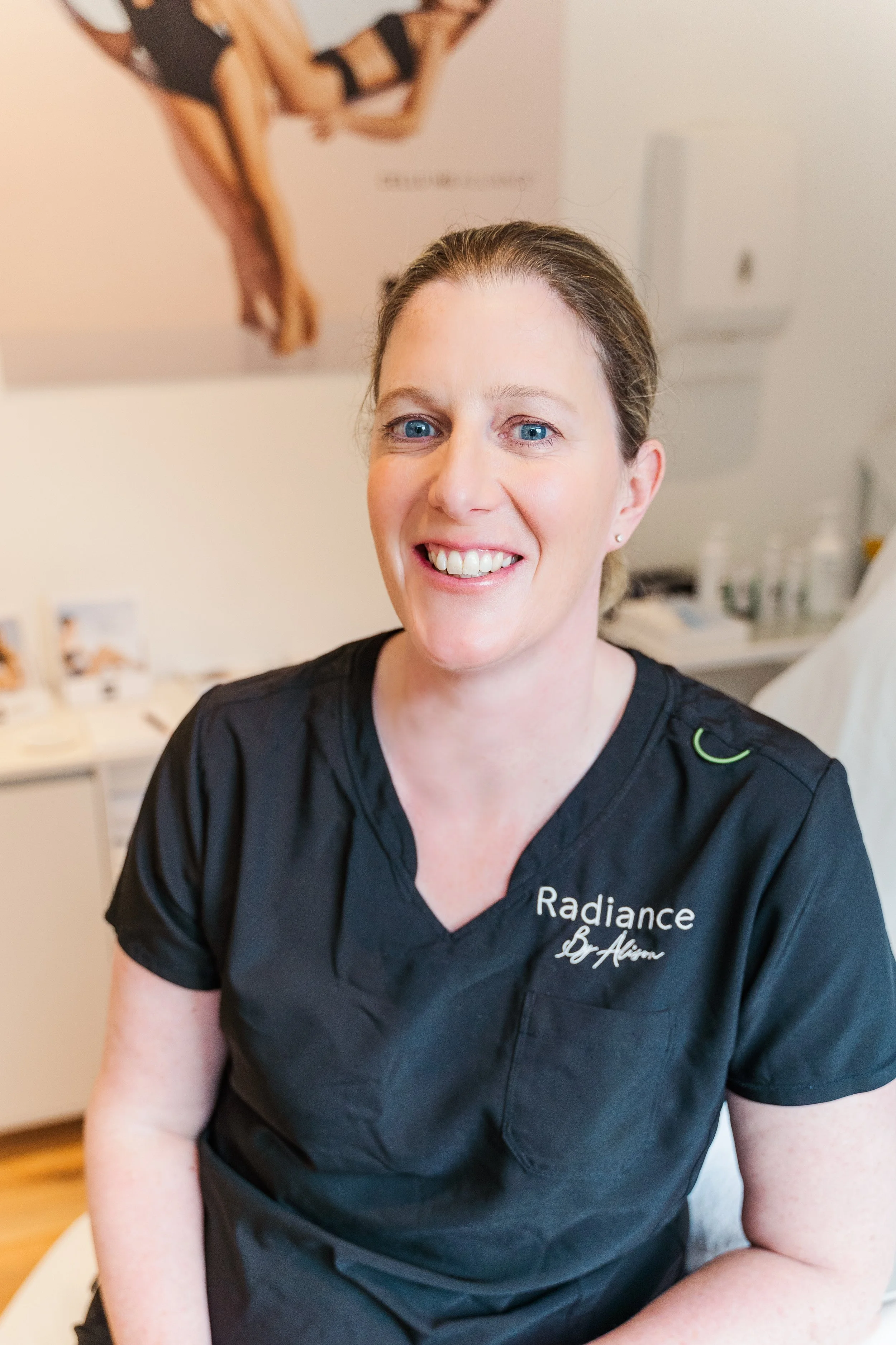 Alison sat on the treatment coach in her clinic