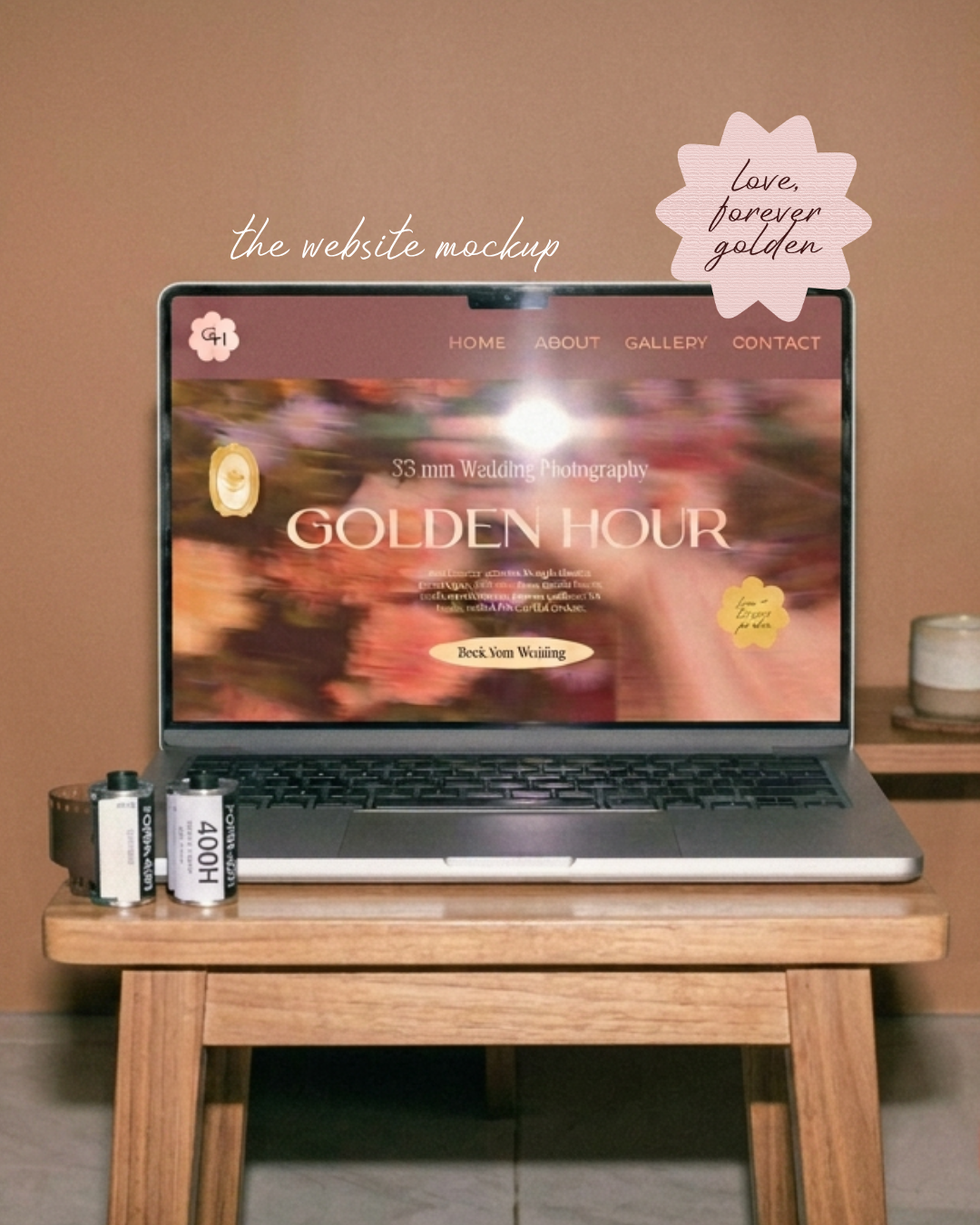 Laptop on wooden table displaying a website mockup for wedding photography called Golden Hour, with a blurred background and decorative tags that say 'Love, forever golden' and 'Love trumps pain.'