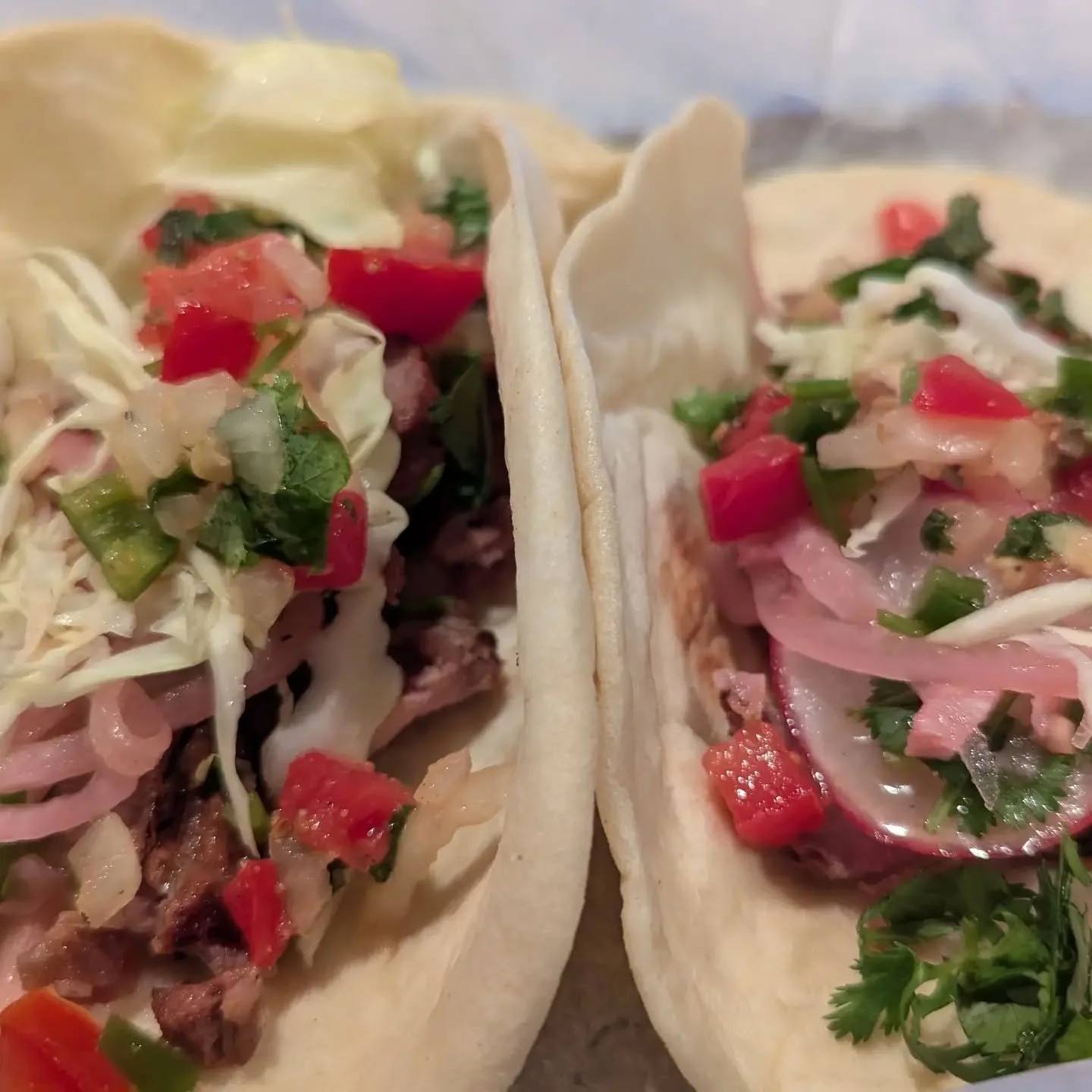 I know flour tortillas aren't traditional but sometimes they just hit. Marinated flank steak with pickled onions, radish, cilantro and pico.