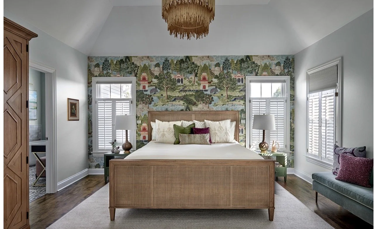 Elegant bedroom design in Atlanta with a wooden bed, floral wallpaper, and chandelier lighting. Styled with layered textures, natural light, and curated decor, this space offers a warm, inviting, and sophisticated interior design aesthetic.