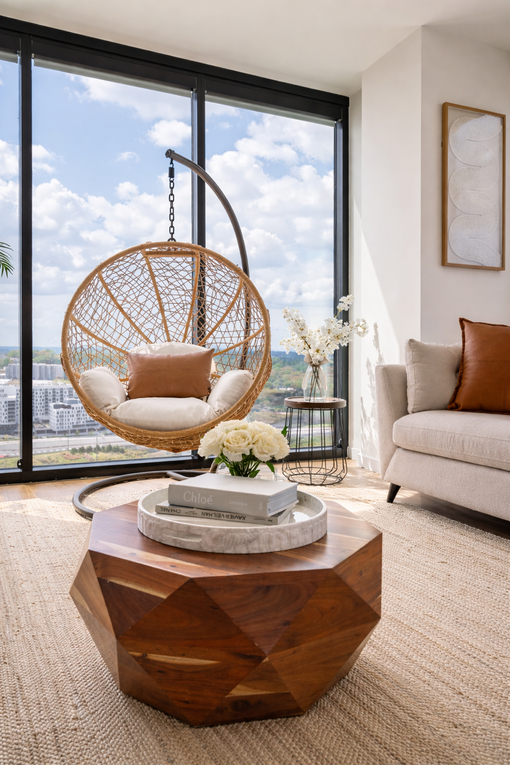 Modern luxury living room design featuring a neutral sofa, layered textures, and natural elements with floor-to-ceiling windows. This space showcases interior styling, home staging, and curated design for elevated Atlanta living.