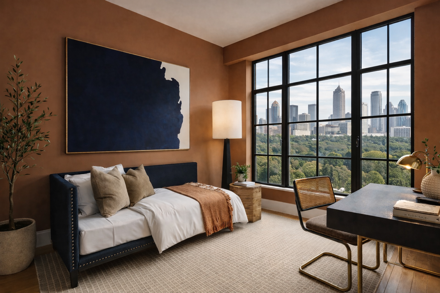 Modern living room design in Atlanta with skyline views, a black sofa, workspace area, and curated decor. This urban space blends contemporary interior design with functional living, natural light, and elevated home styling.