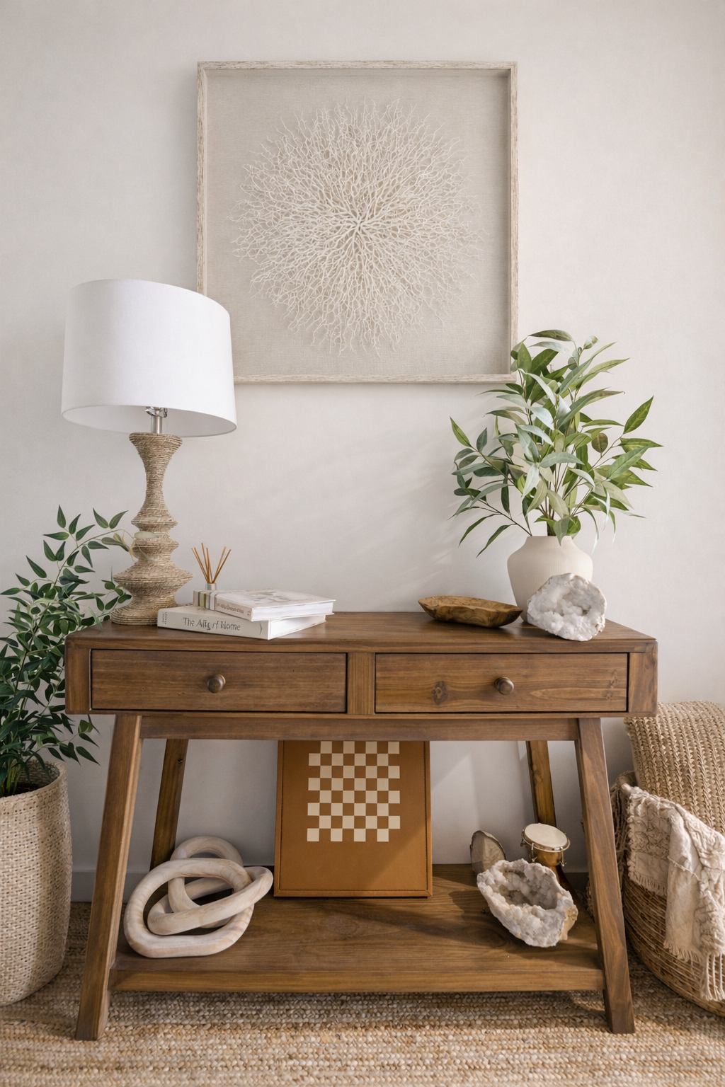 Styled console table featuring layered decor, books, greenery, and soft lighting. This vignette showcases detailed interior styling, curated accents, and elevated home decor for modern, luxury interiors.