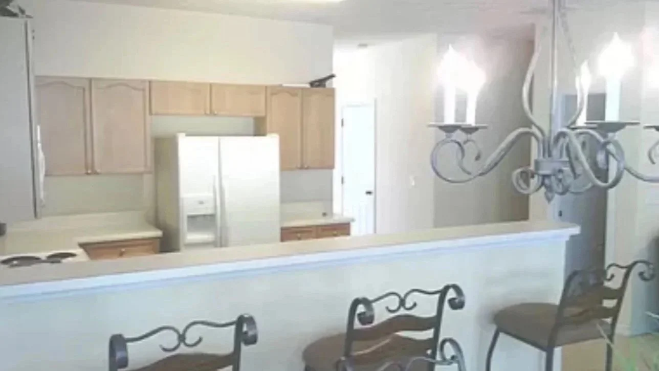 Kitchen with light cabinetry and traditional finishes, highlighting the pre-design phase of a renovation. This space reflects the potential for a modern transformation through interior design and home staging in Atlanta.